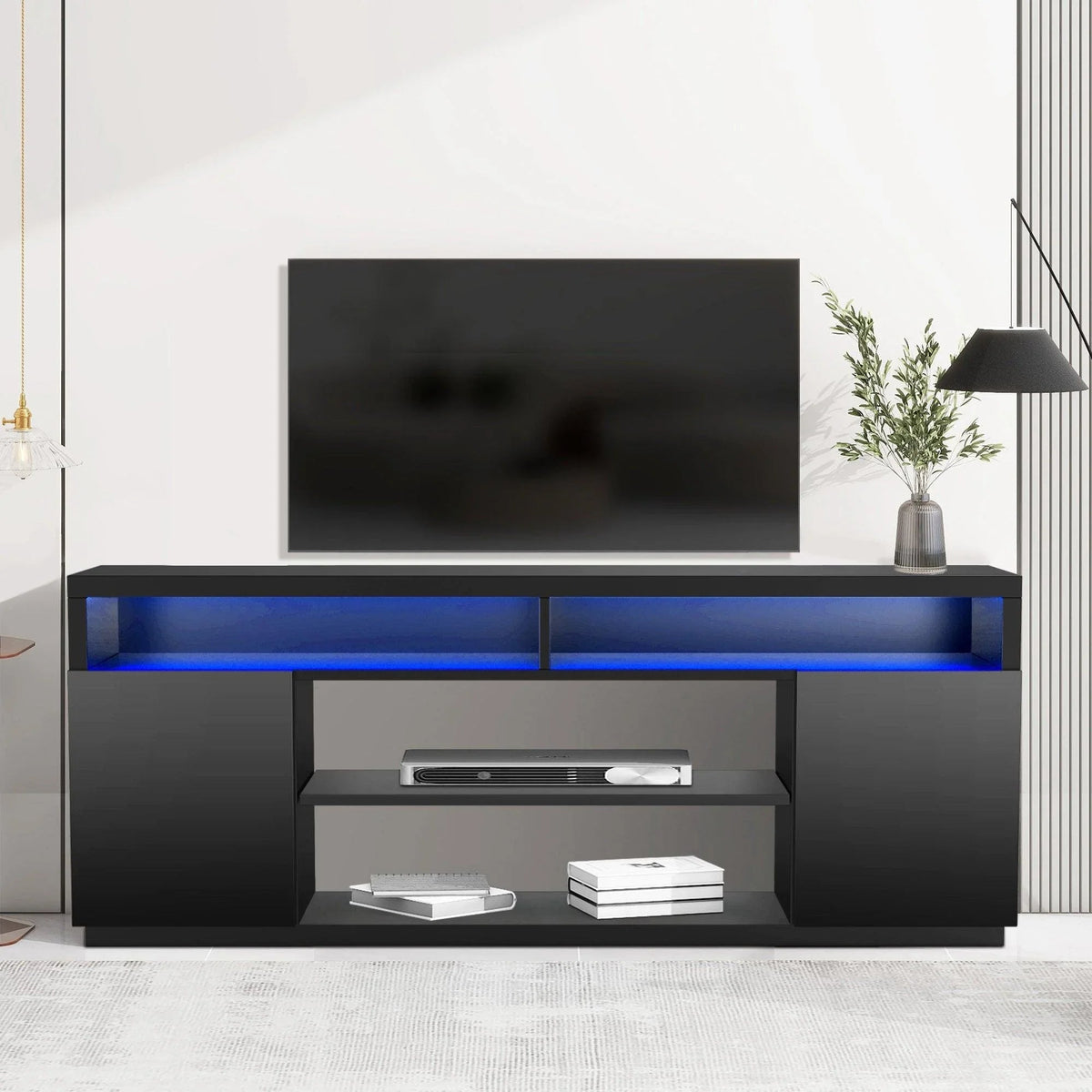 Black TV stand media console with blue LED accent lighting and open storage