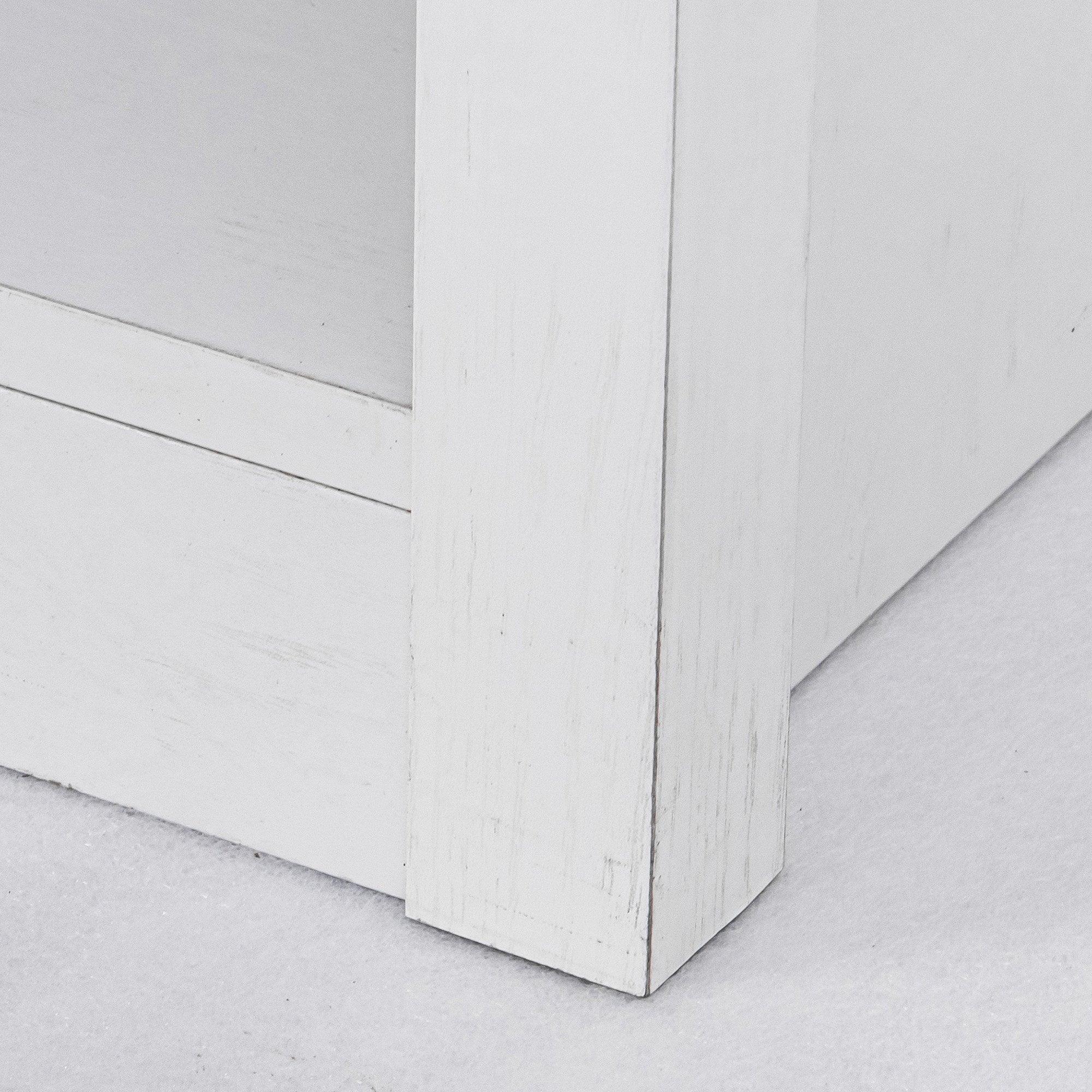 White LED TV stand base corner showing cabinet legs and panel join