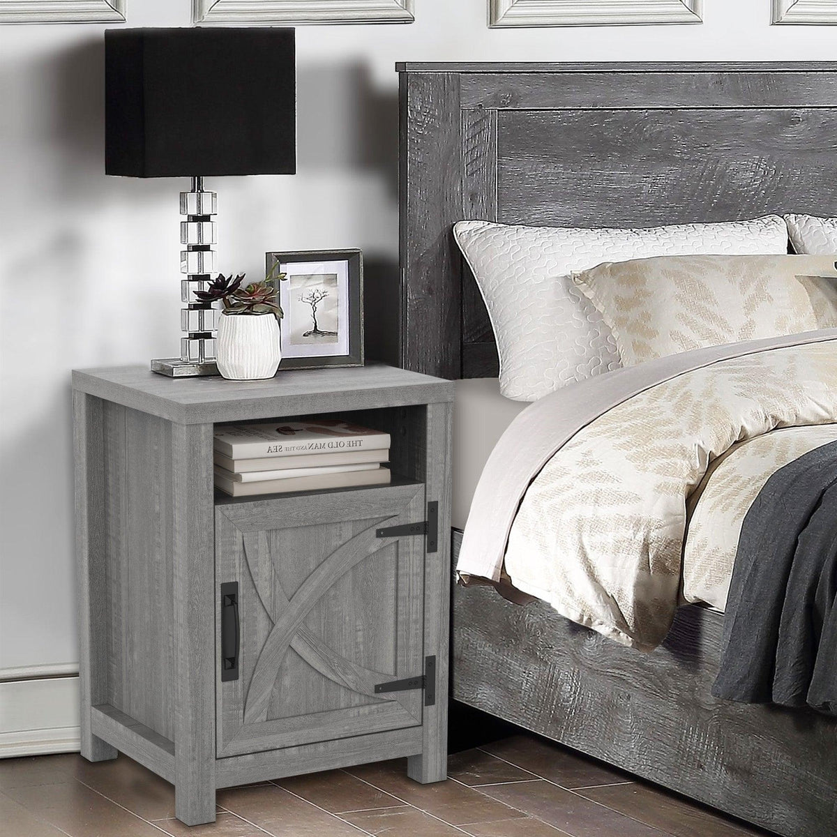 Gray farmhouse nightstand with cabinet door and top surface next to bed