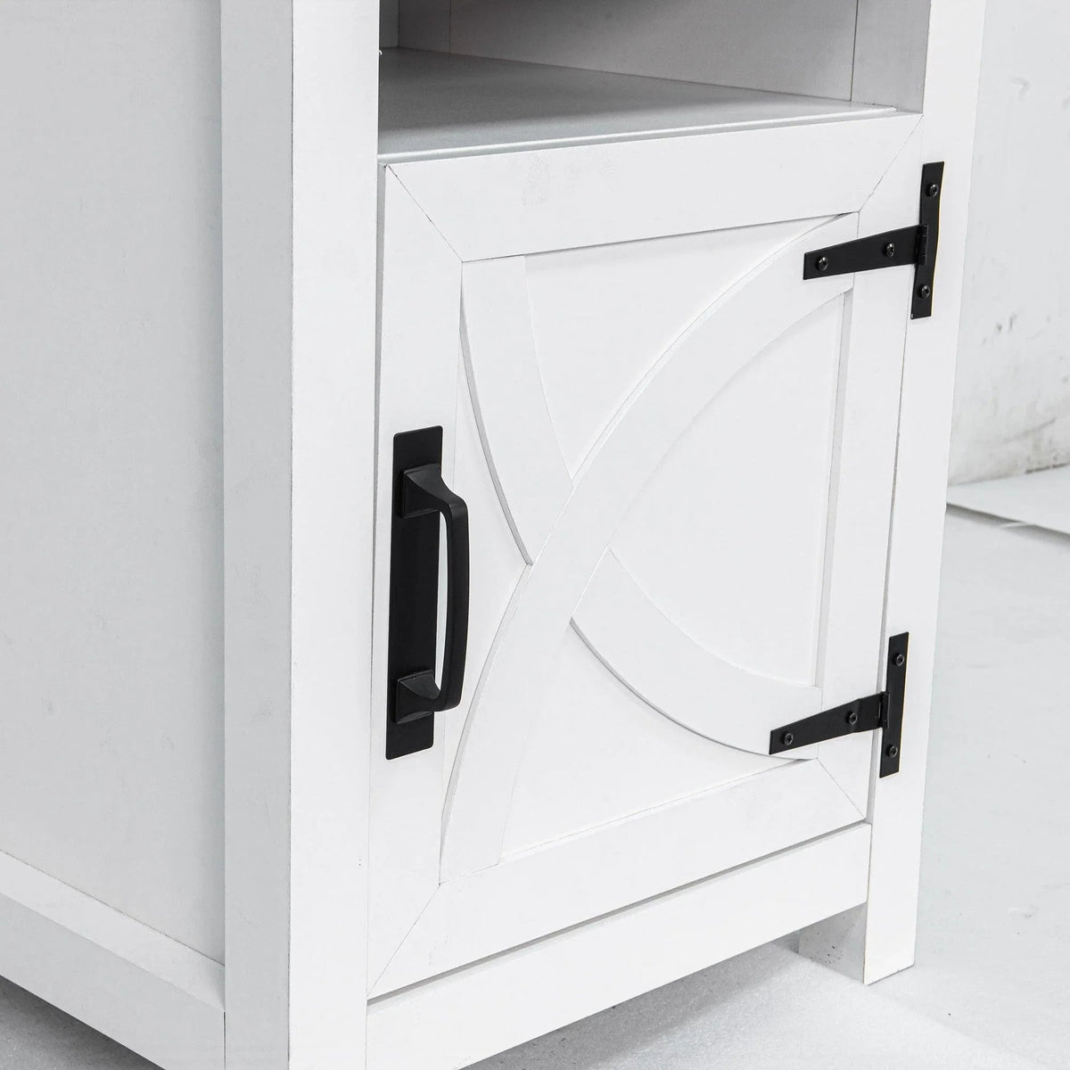 White solid wood nightstand with raised door panel and black bar handle