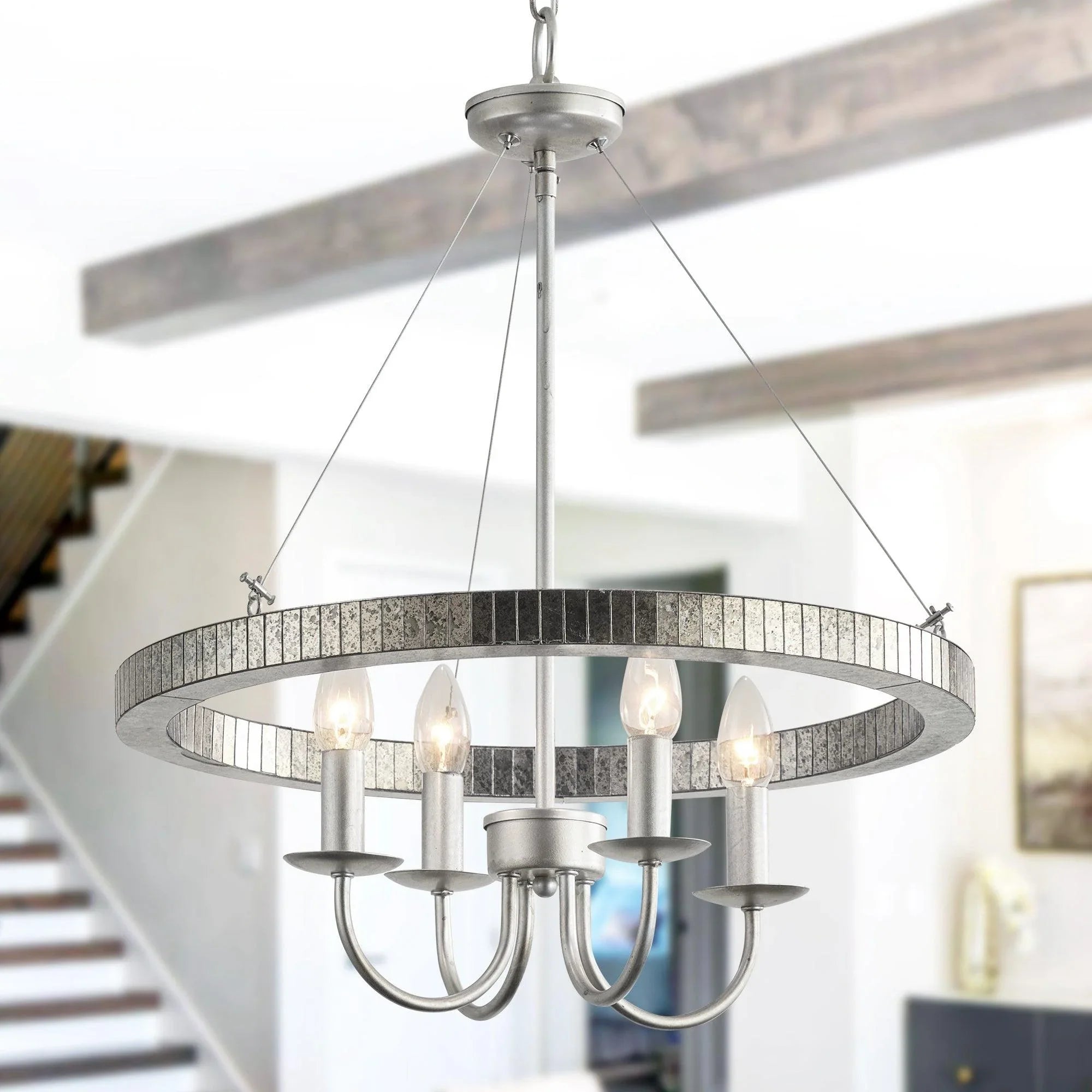 Satin nickel pendant with textured ring and lit clear acrylic bulb shades on curved arms
