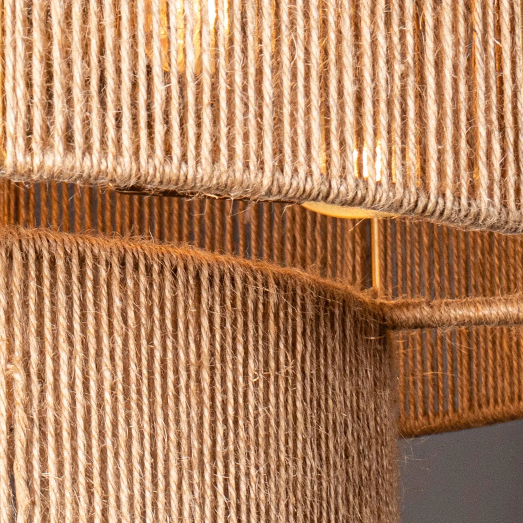 Close-up of natural rope drum shade texture and antique gold frame