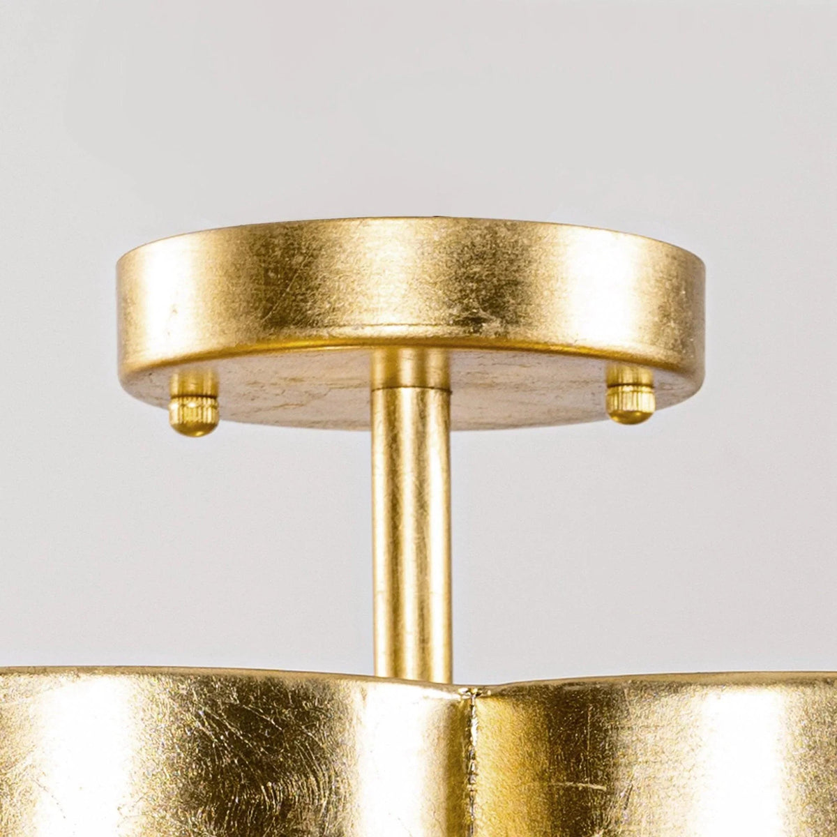 Golden semi-flush ceiling light with ribbed drum shade and three lamp holders