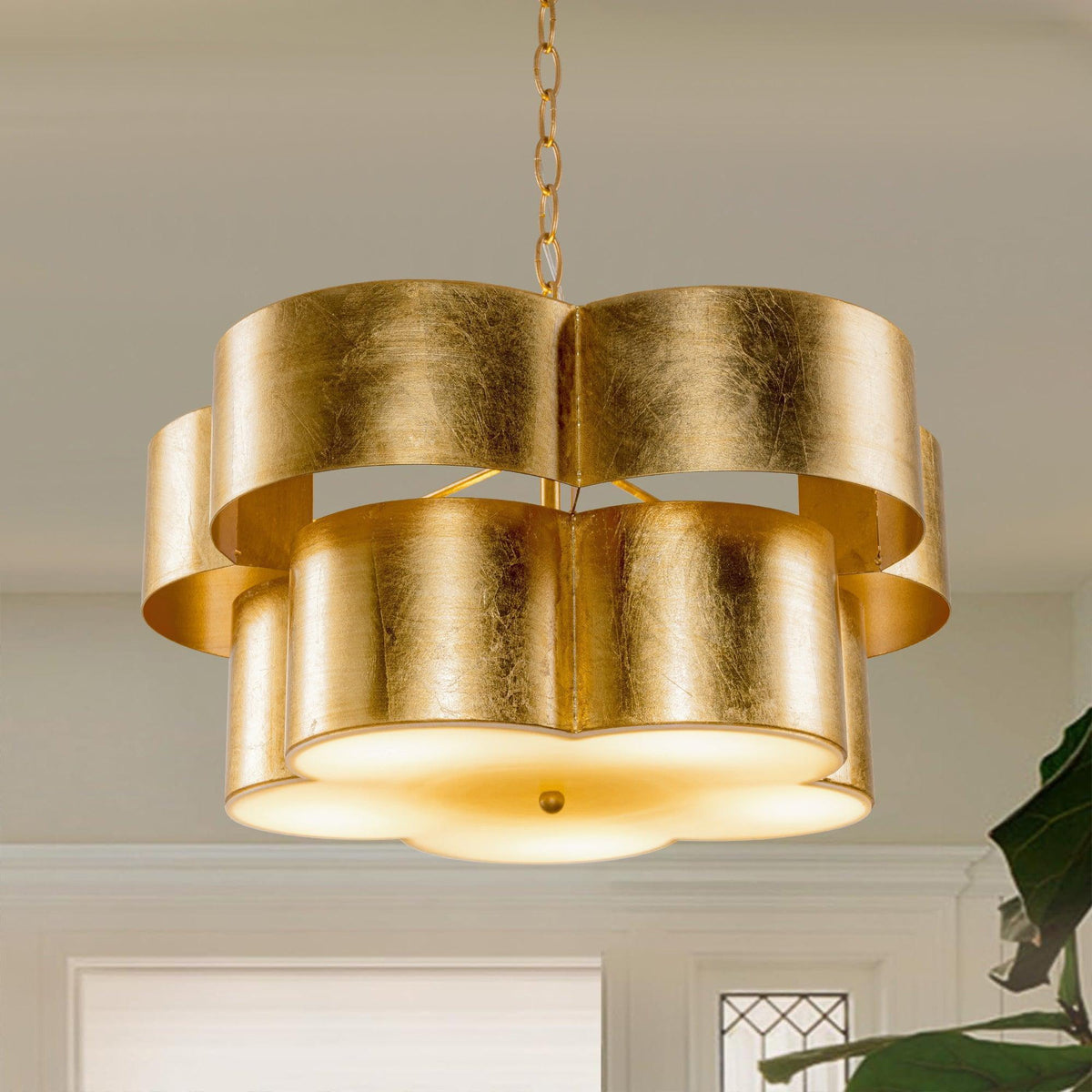 Golden 5-light island pendant with layered cylindrical drum shades and metal chain
