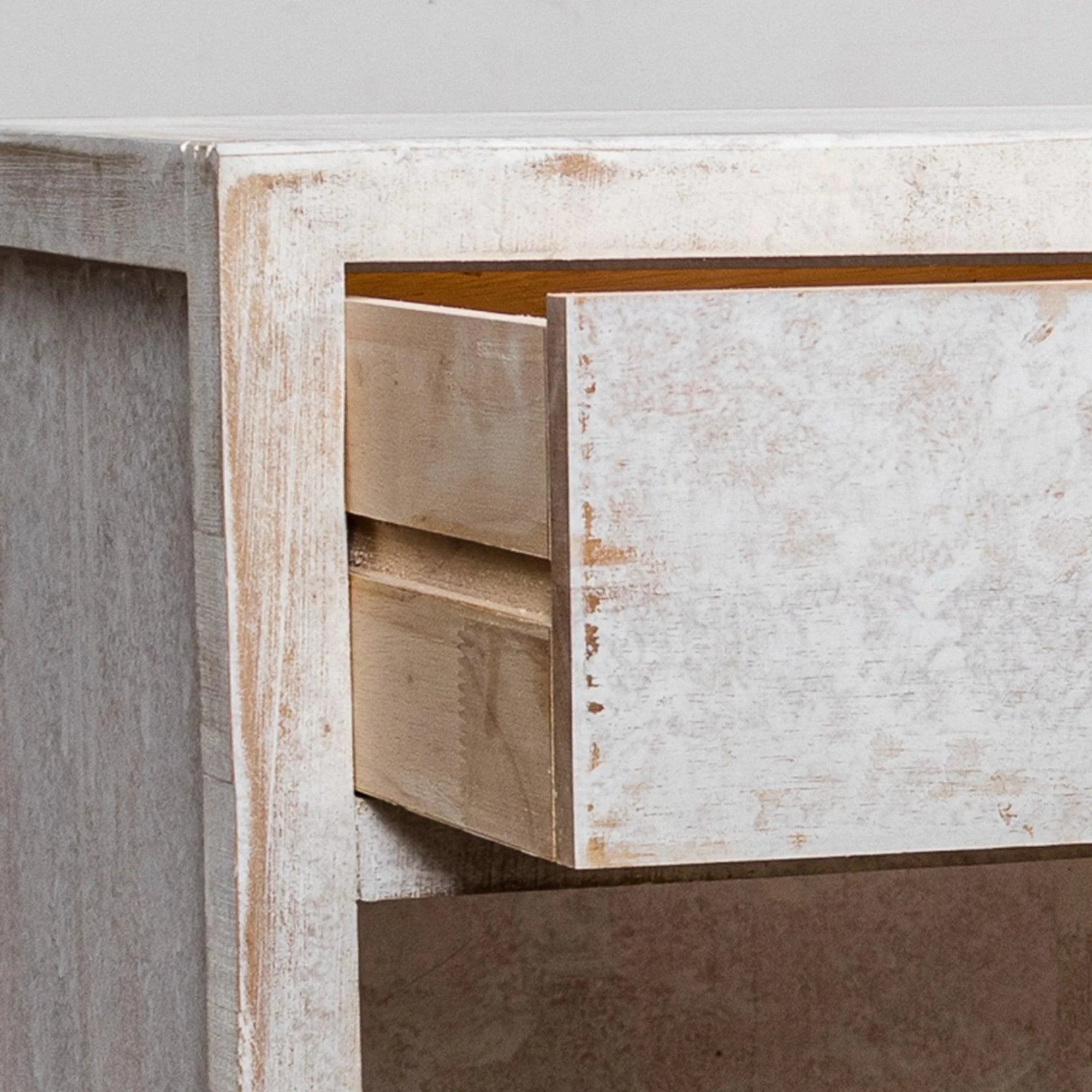 White solid wood nightstand with open drawer and internal shelf