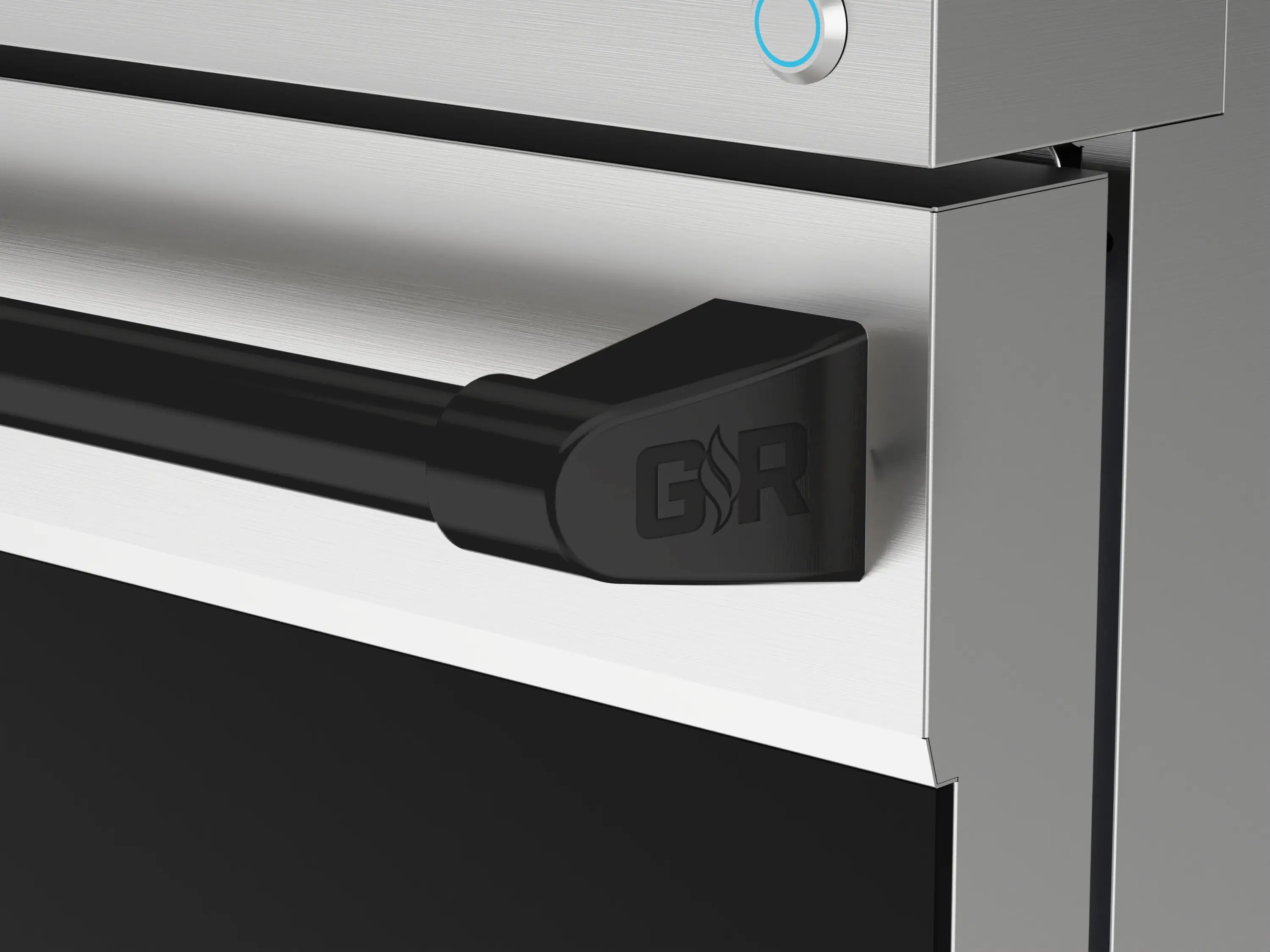 Stainless gas range control panel corner with black trim handle and GR logo