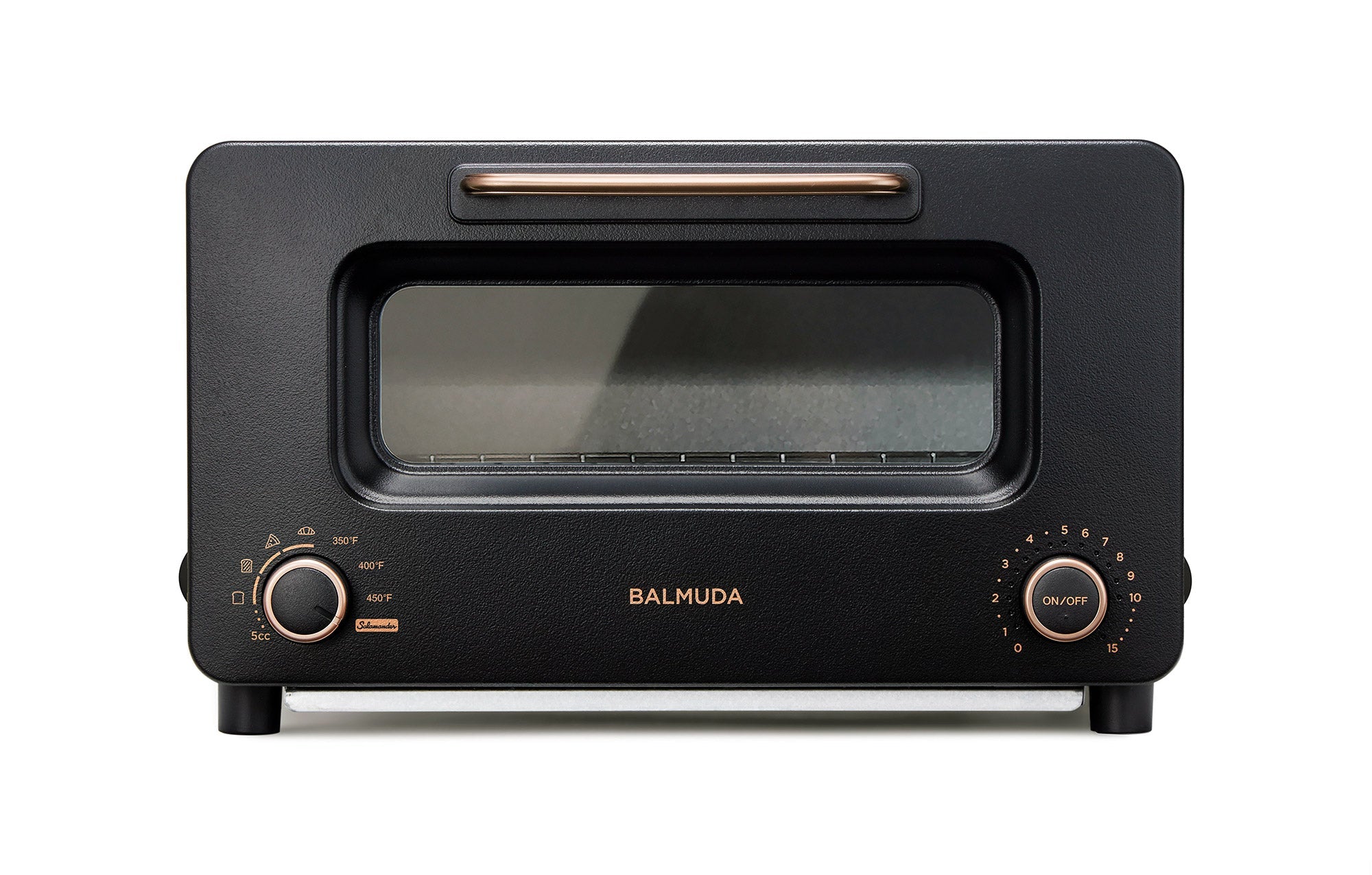 Black countertop toaster oven with glass door, front dials, and BALMUDA logo