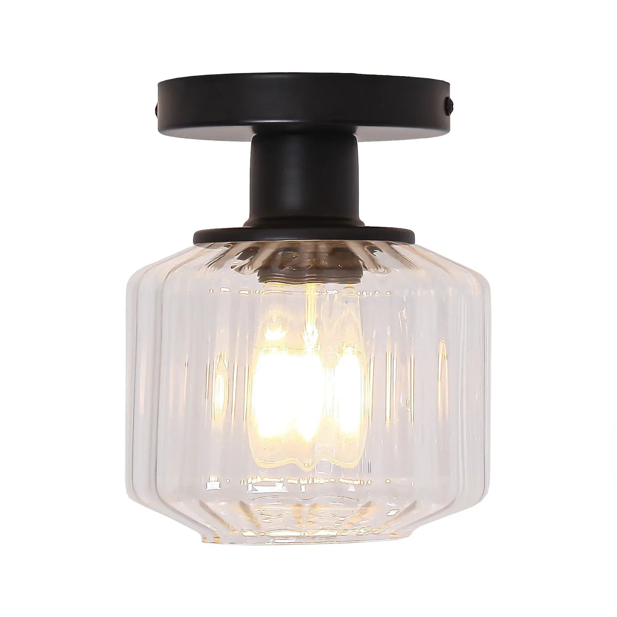Black semi-flush mount ceiling light with clear glass shade and illuminated bulb