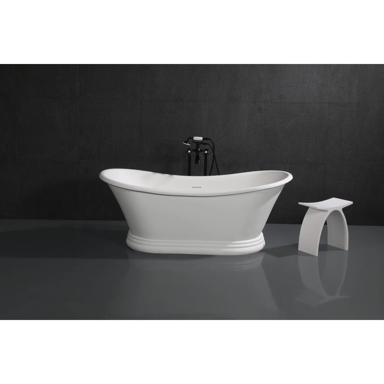 Matte black freestanding tub faucet with cross handles on a white oval soaking tub