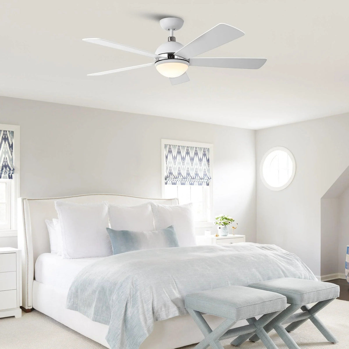 Ceiling fan with five white blades and frosted LED light centered under the hub
