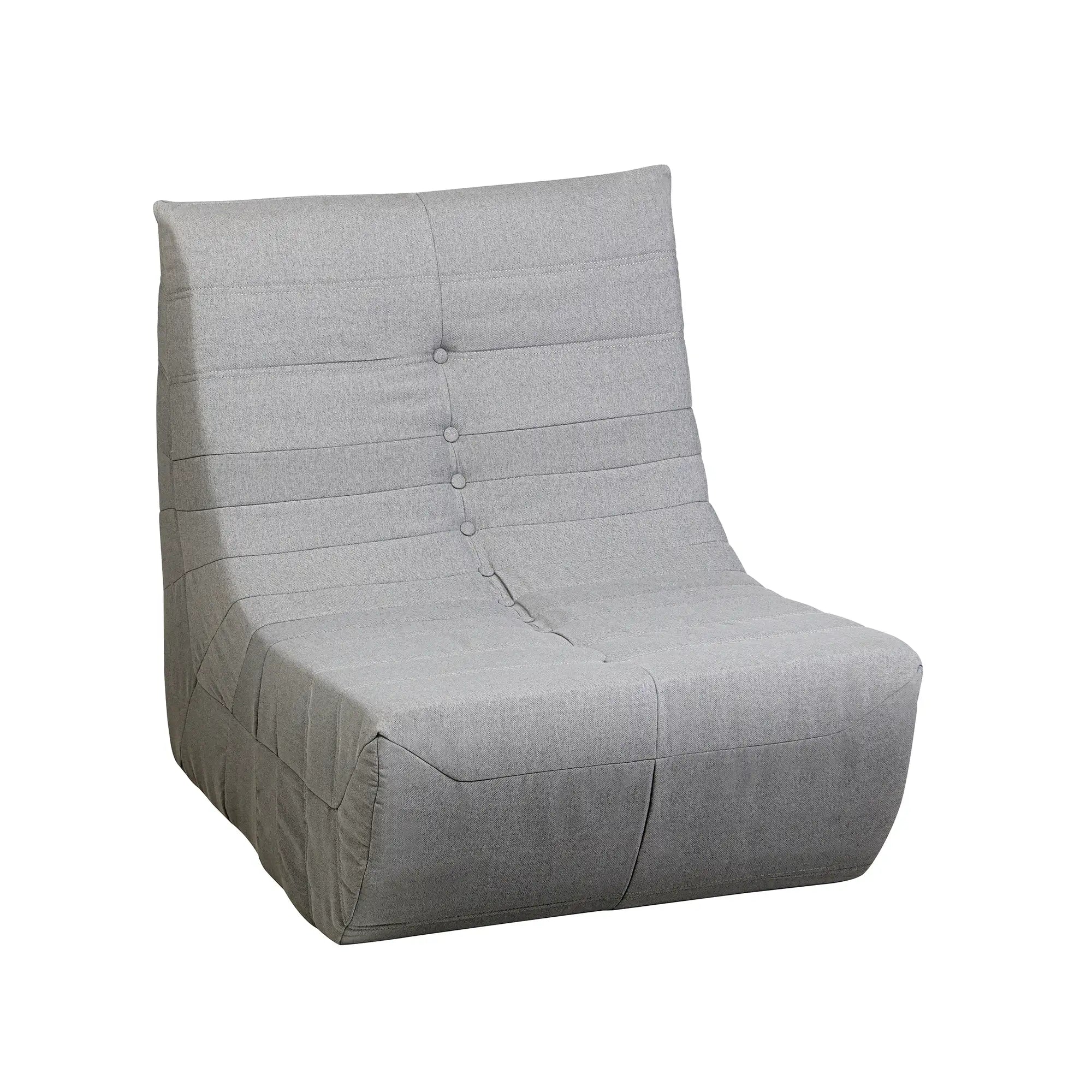 Gray compressed foam accent chair with tufted back, curved arms, and padded seat.
