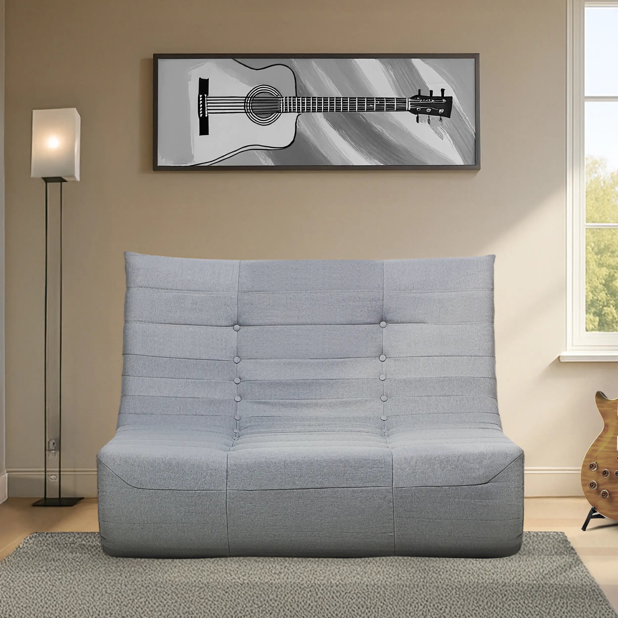 Gray compressed foam sofa with tufted back and cushioned seat