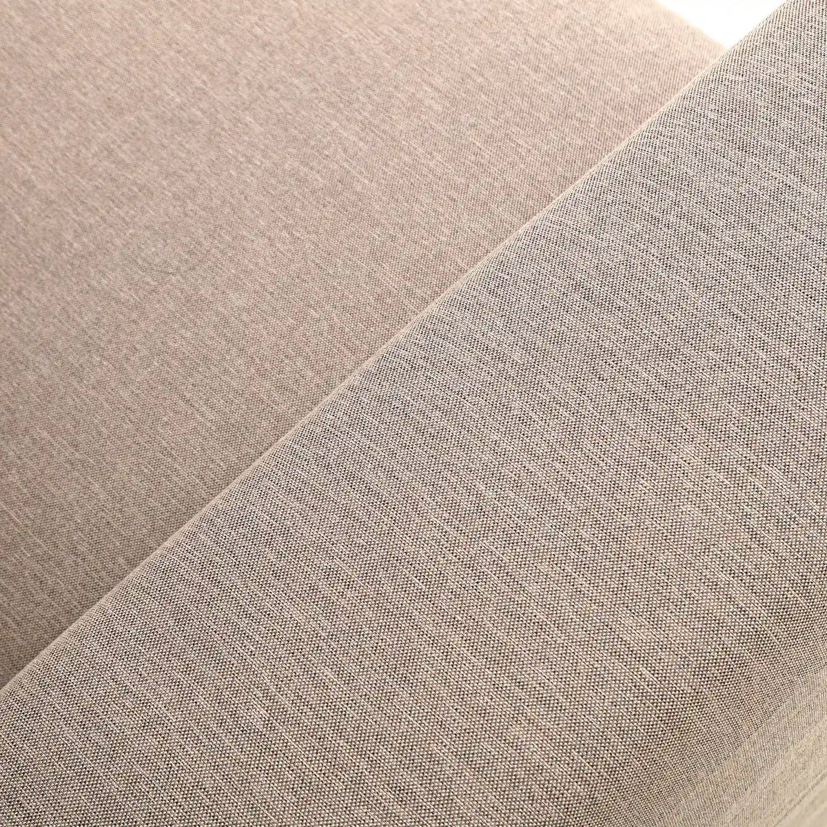 Beige upholstered fabric texture close-up with fine woven weave