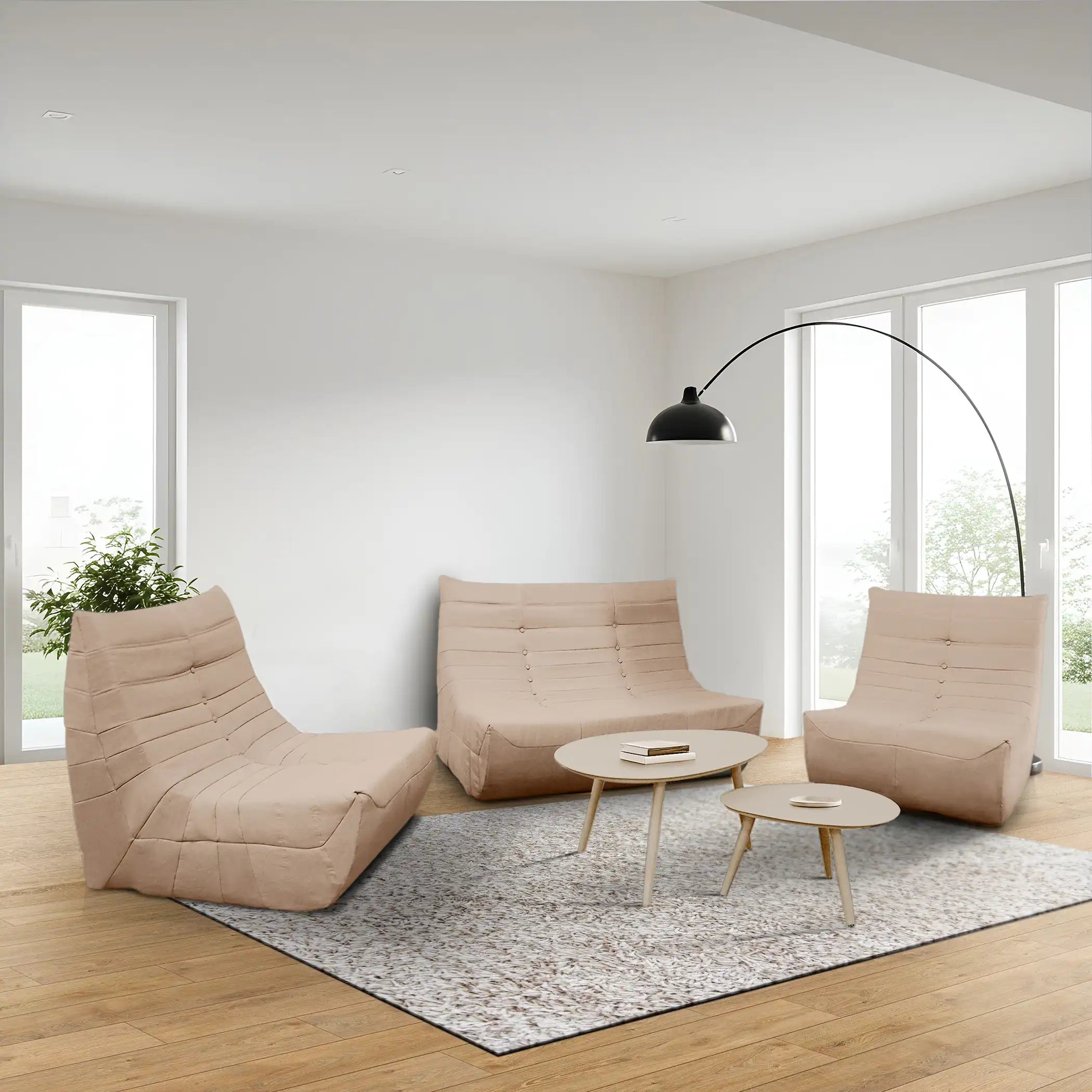 Taupe-brown compressed foam lounge chairs set with round coffee tables in a room