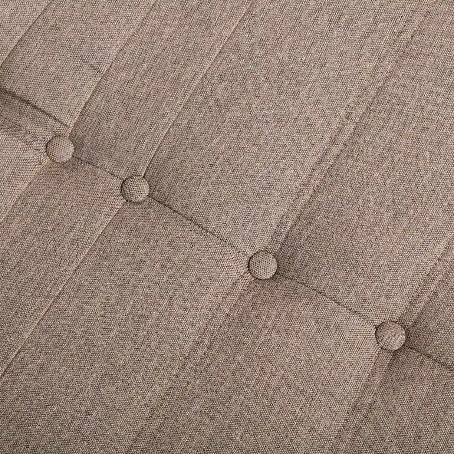 Brown textured fabric upholstery with button-tufted cushions on a compressed foam sofa.