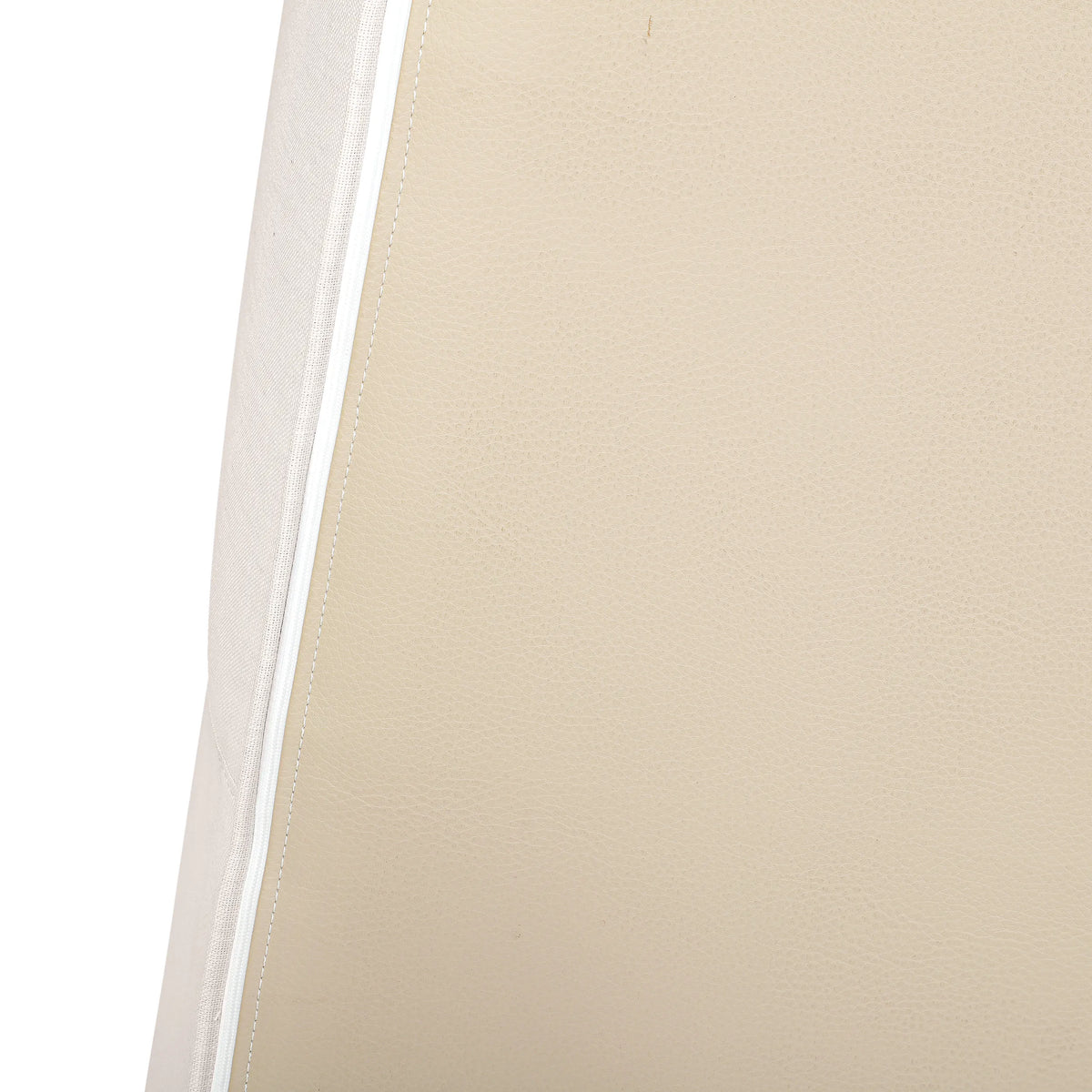 Close-up of beige upholstered sectional sofa fabric with visible seam stitching.