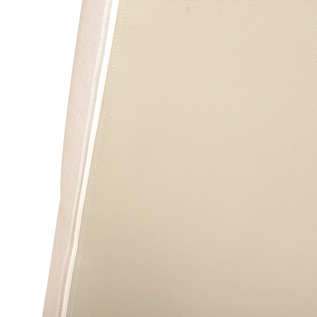 Beige upholstery edge seam with clean stitched border