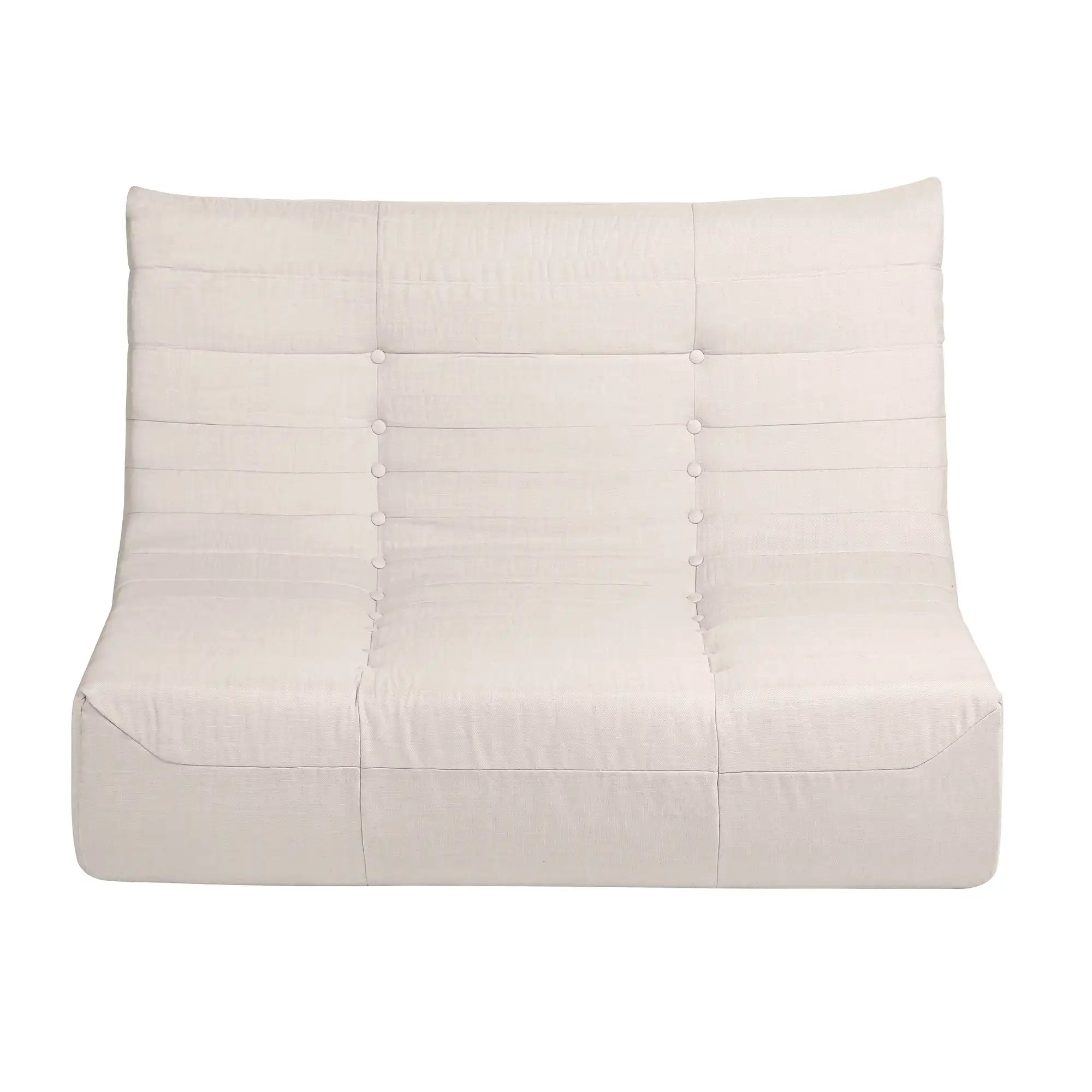 Beige compressed-foam sofa with button-tufted back panel and smooth seat.