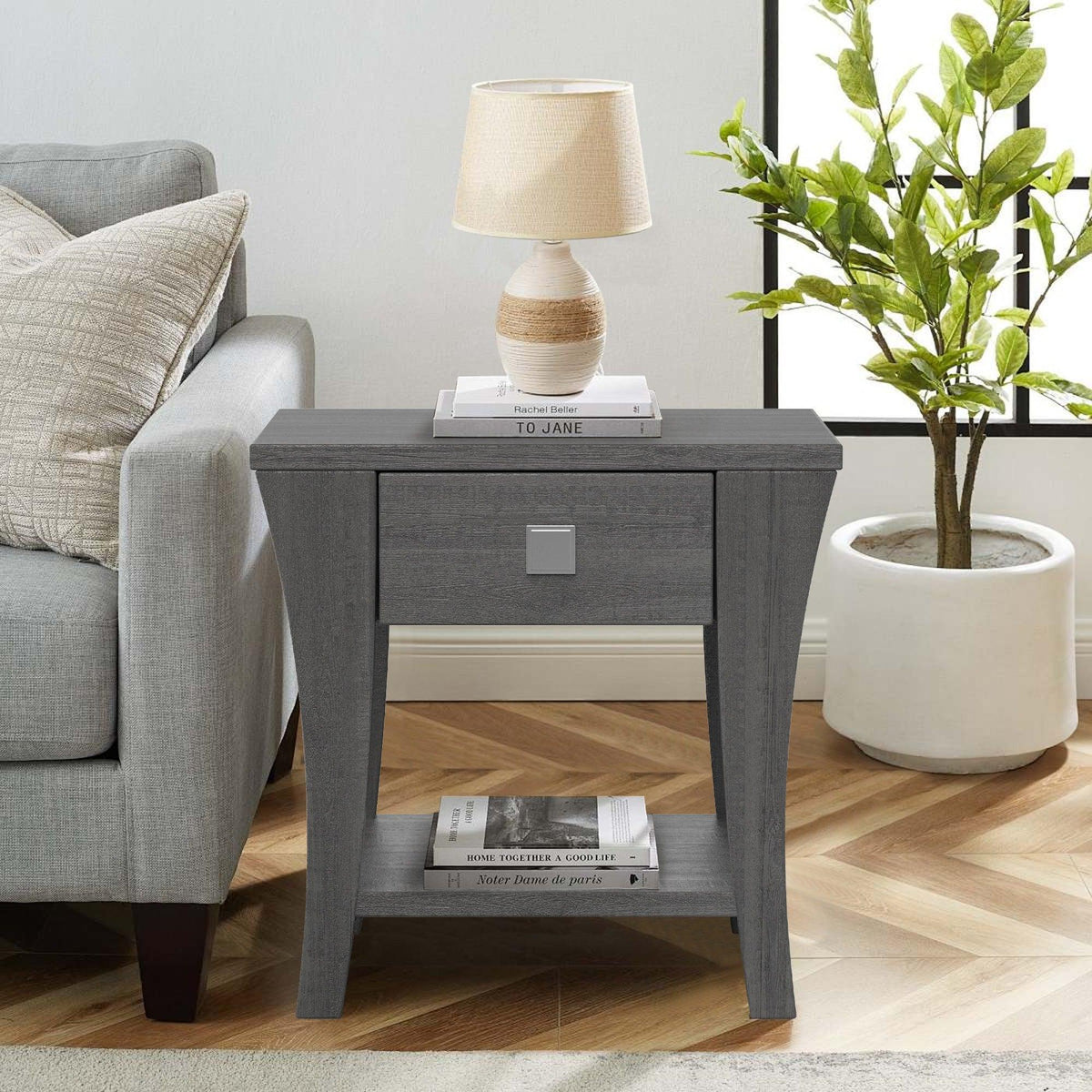 Gray end table with one drawer and open lower shelf, metal pull handle.