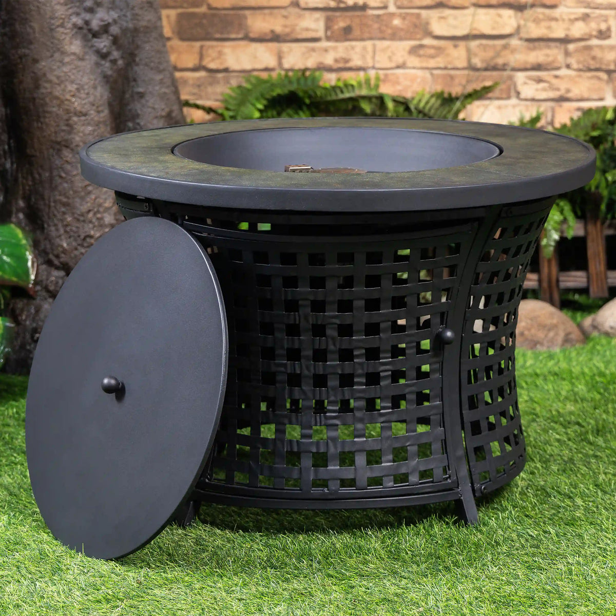 Round black propane fire pit table with front side panel open, lattice fire bowl