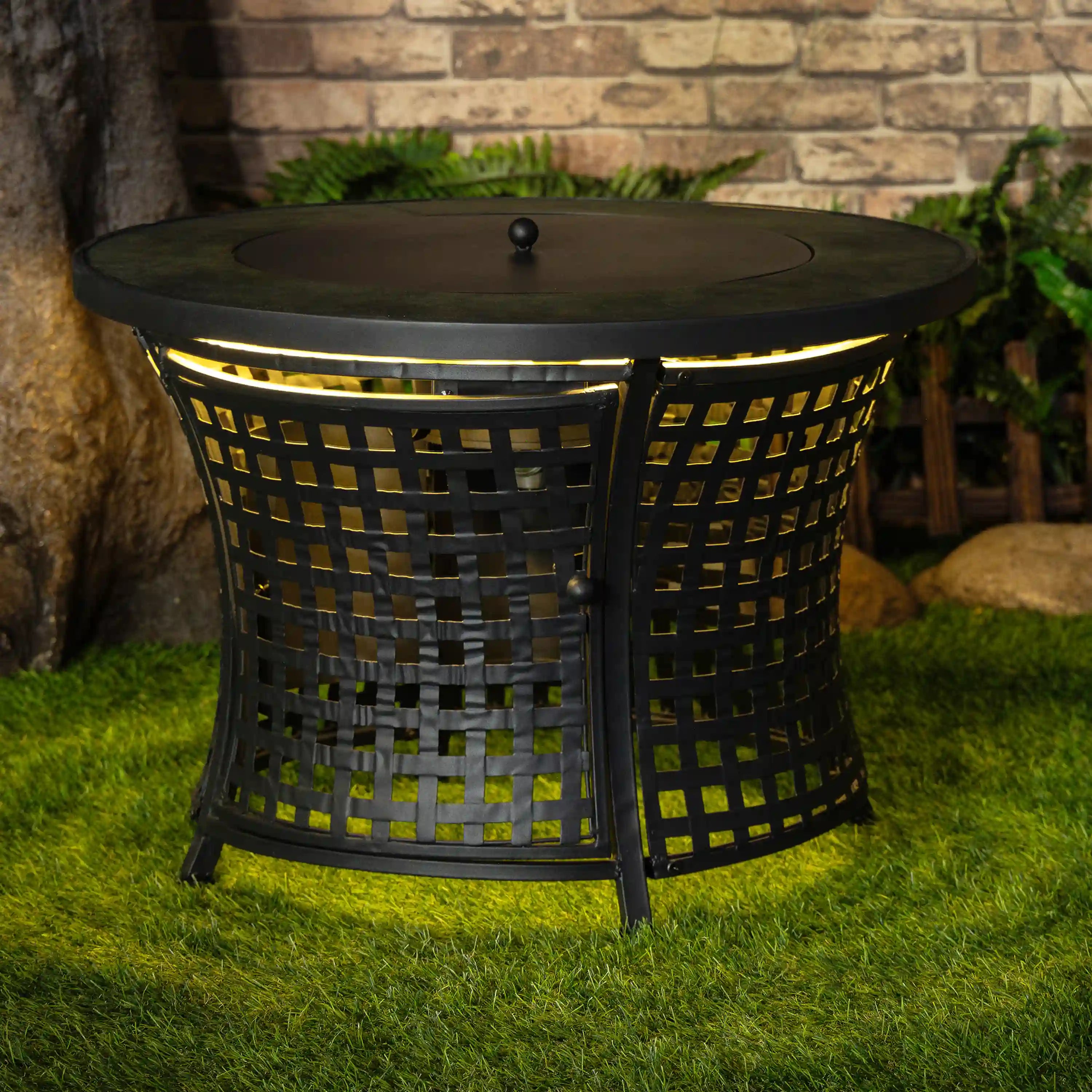 Black round outdoor propane fire pit table with mesh sides and dark round lid