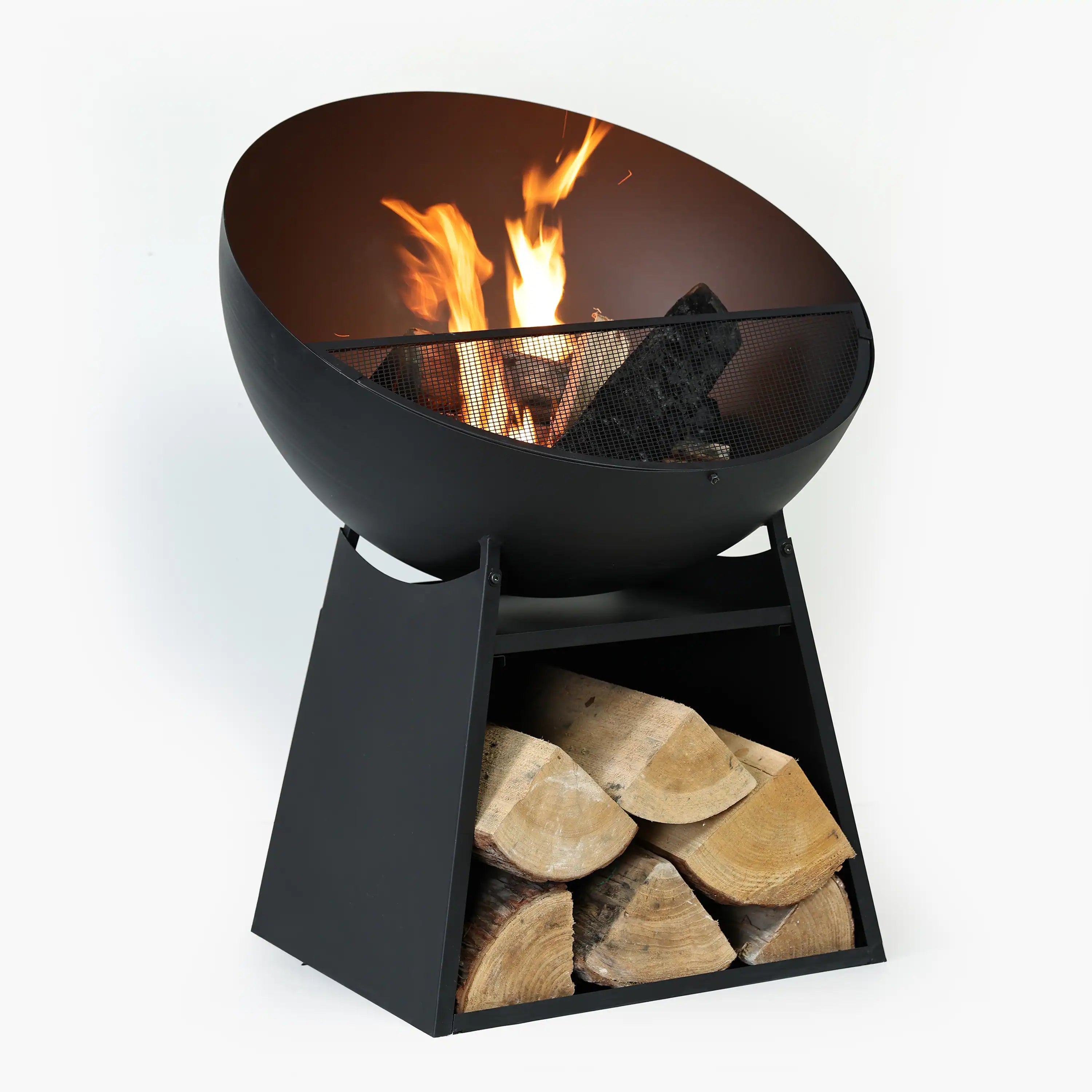 Black round fire pit with flames visible through the spark screen and logs inside.