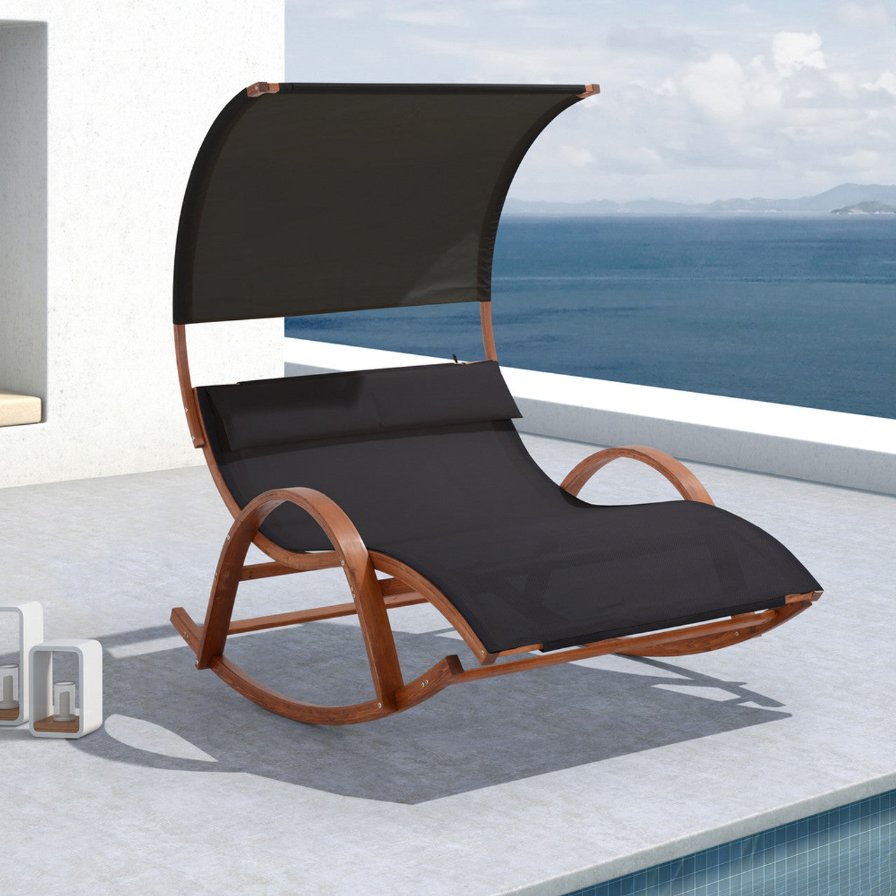 Outdoor cedar lounge daybed with black canopy, curved back, and black textilene seat cushion