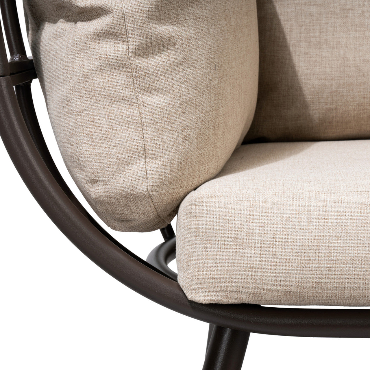 Beige cushion with stitched seams on black rocking base, close-up