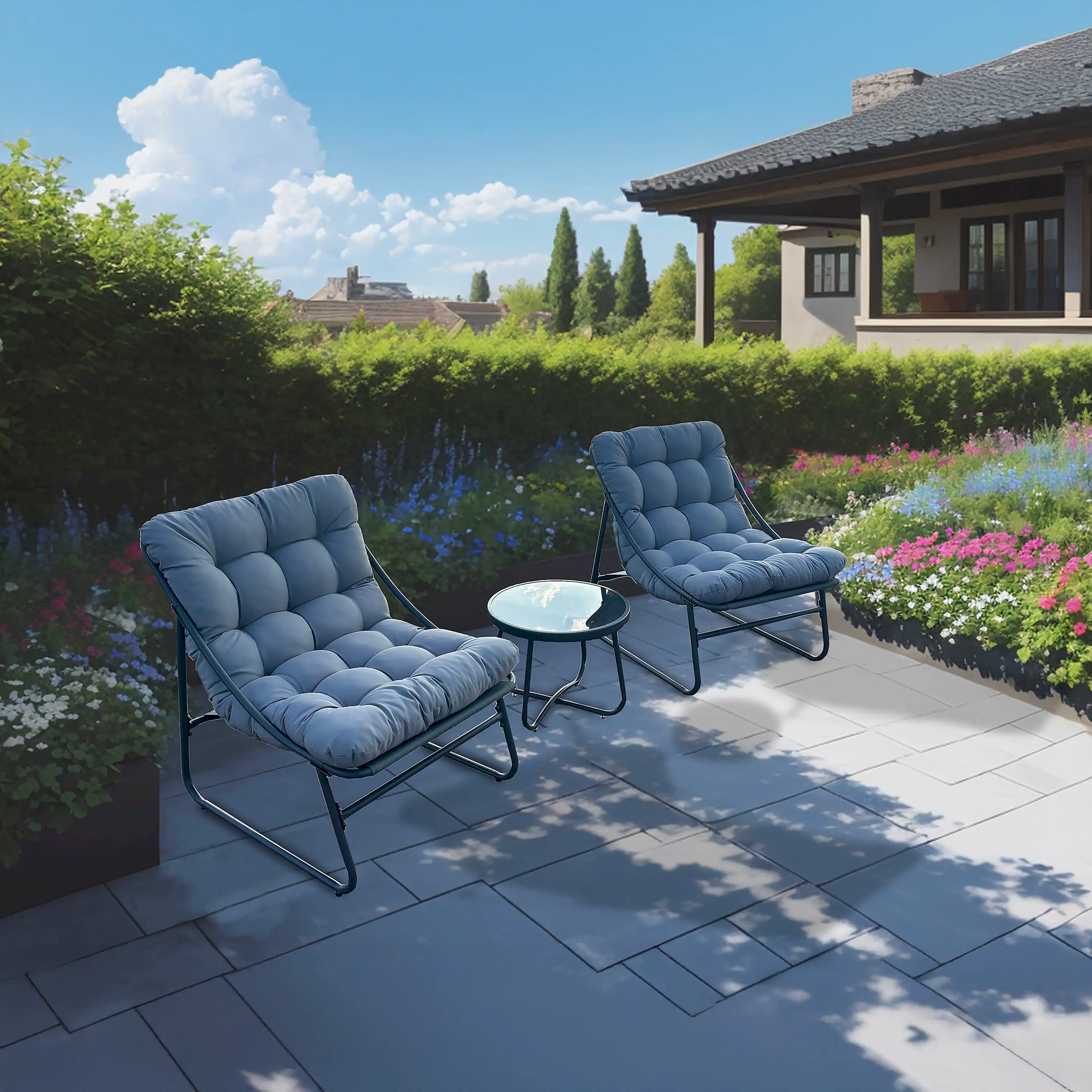 Outdoor patio bistro chairs with blue cushions and round coffee table