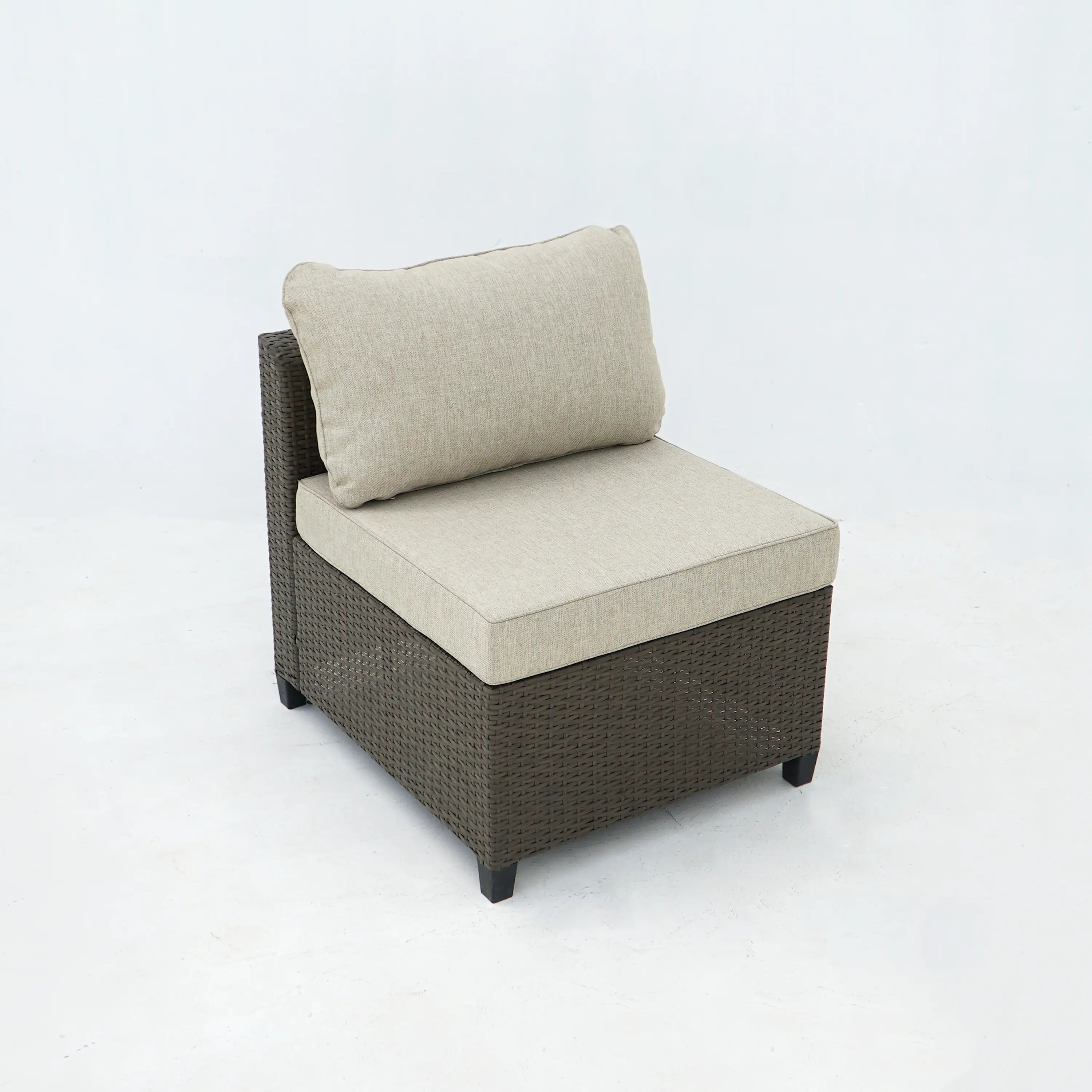 Outdoor wicker lounge chair with light beige seat and back cushions