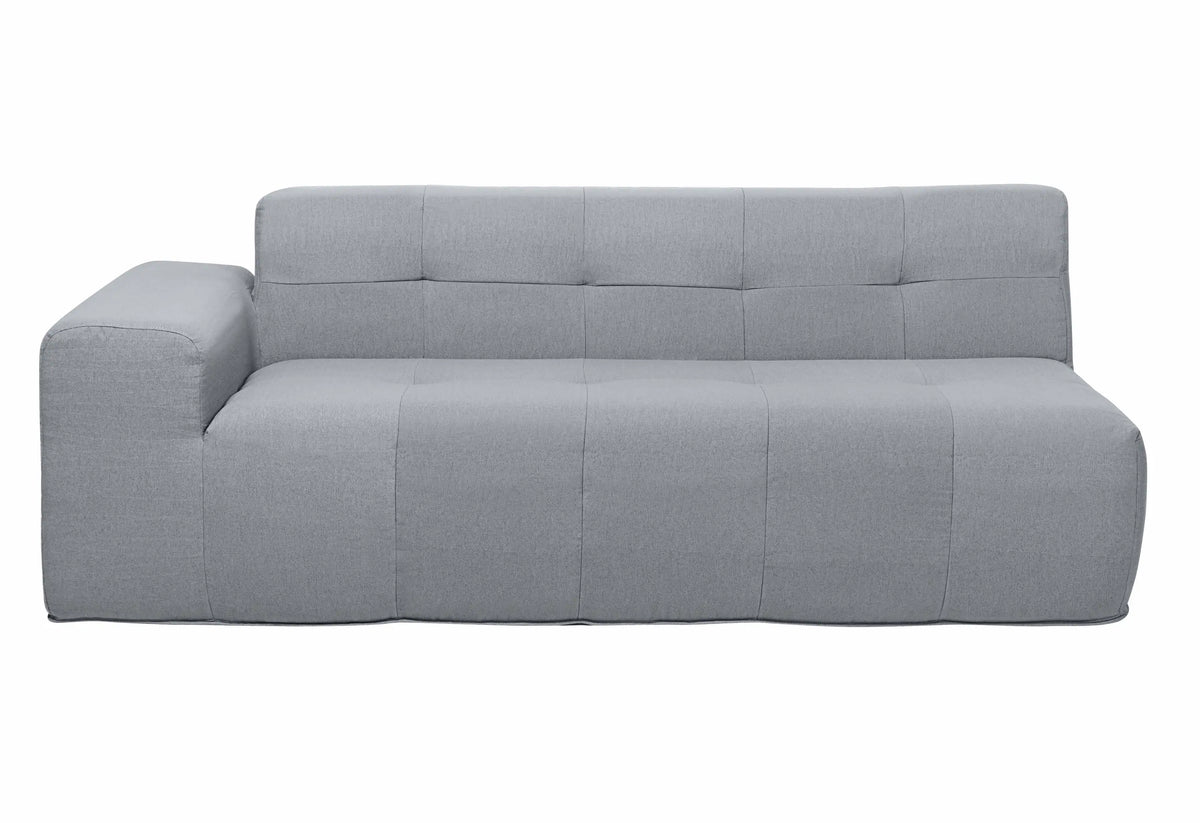 Gray outdoor compressed foam sofa with tufted back panel and padded seat