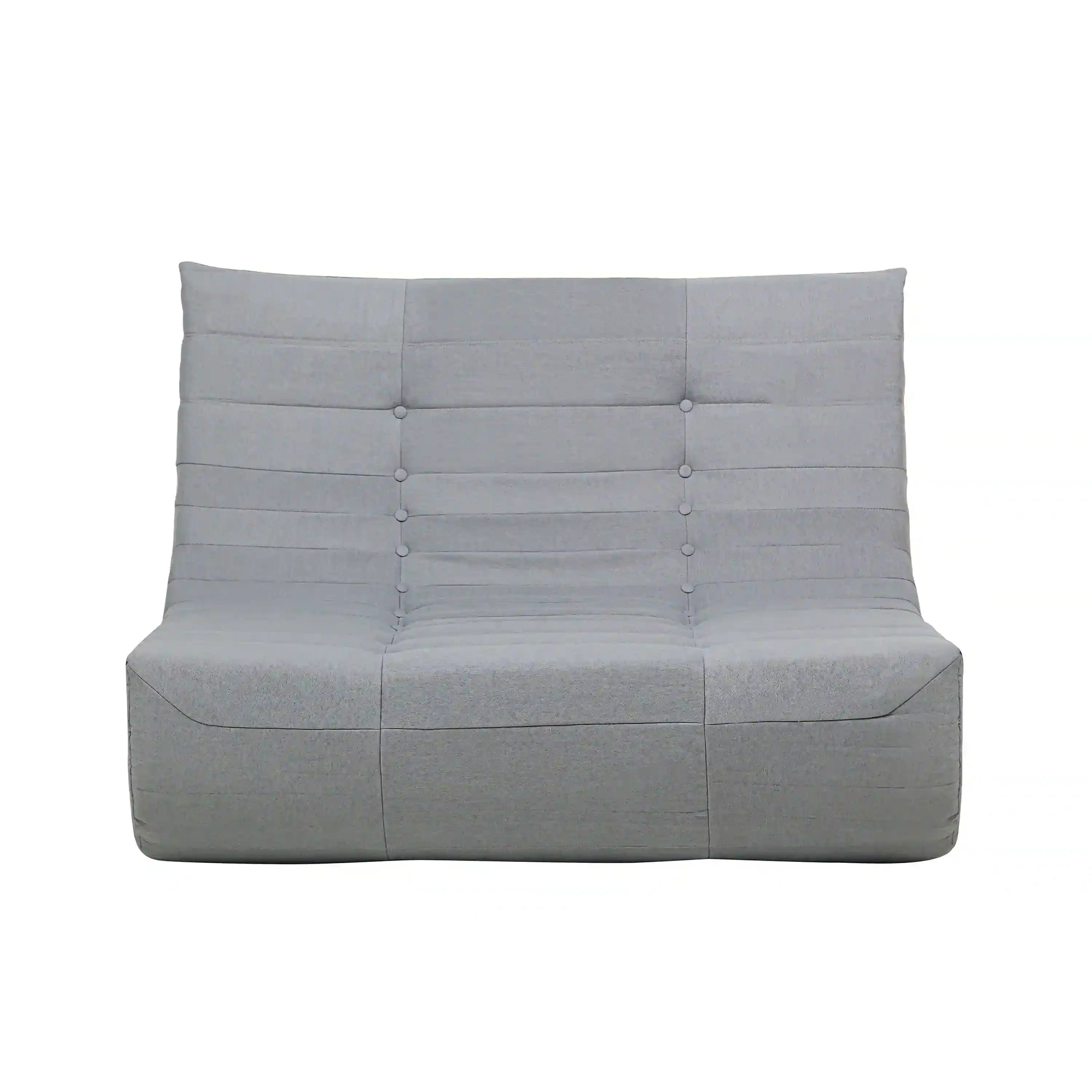 Gray outdoor compressed foam sofa with tufted button back and cushioned seat