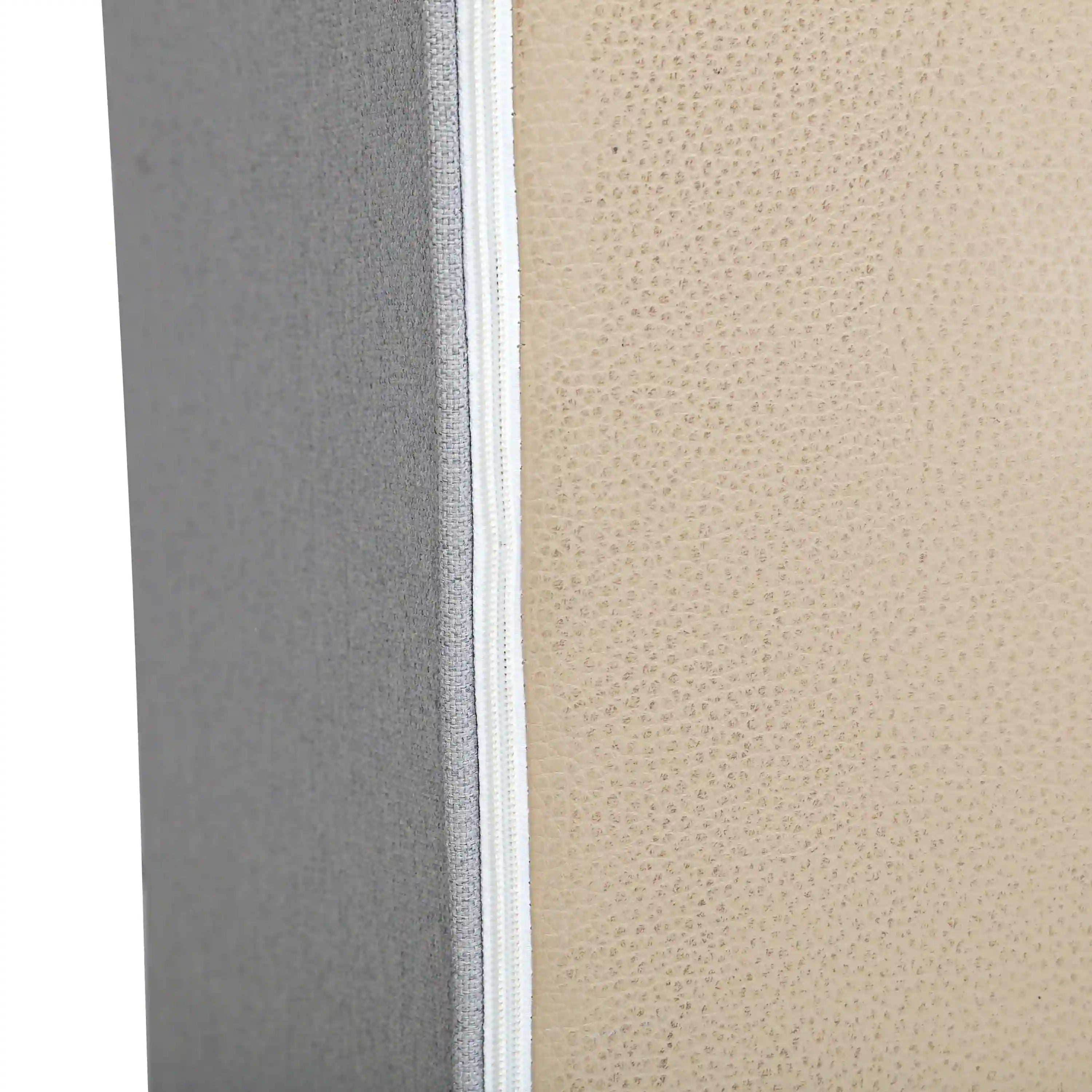 Gray sofa side panel with stitched seam and upholstery edging