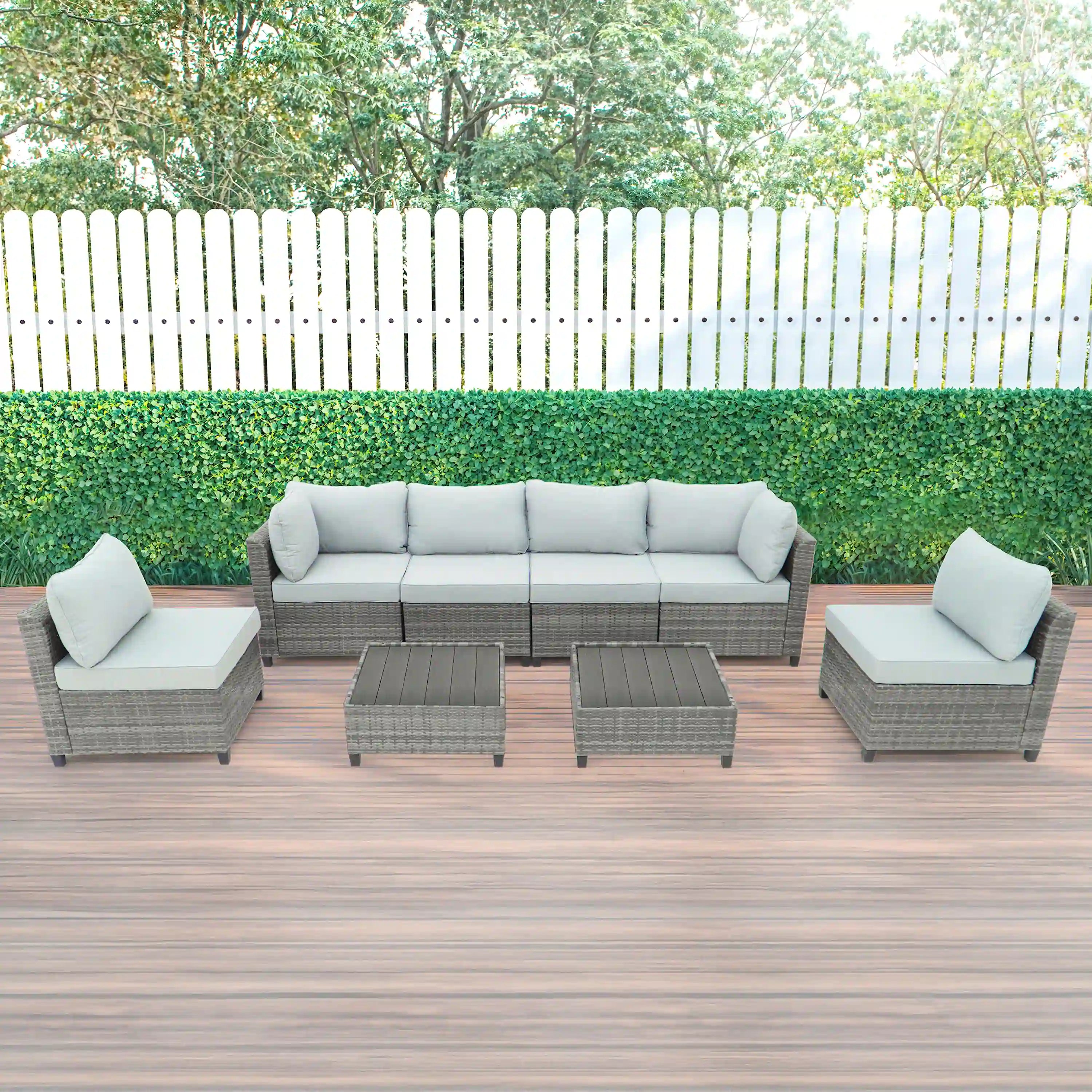 Gray outdoor sectional sofa set with light gray cushions and square side tables