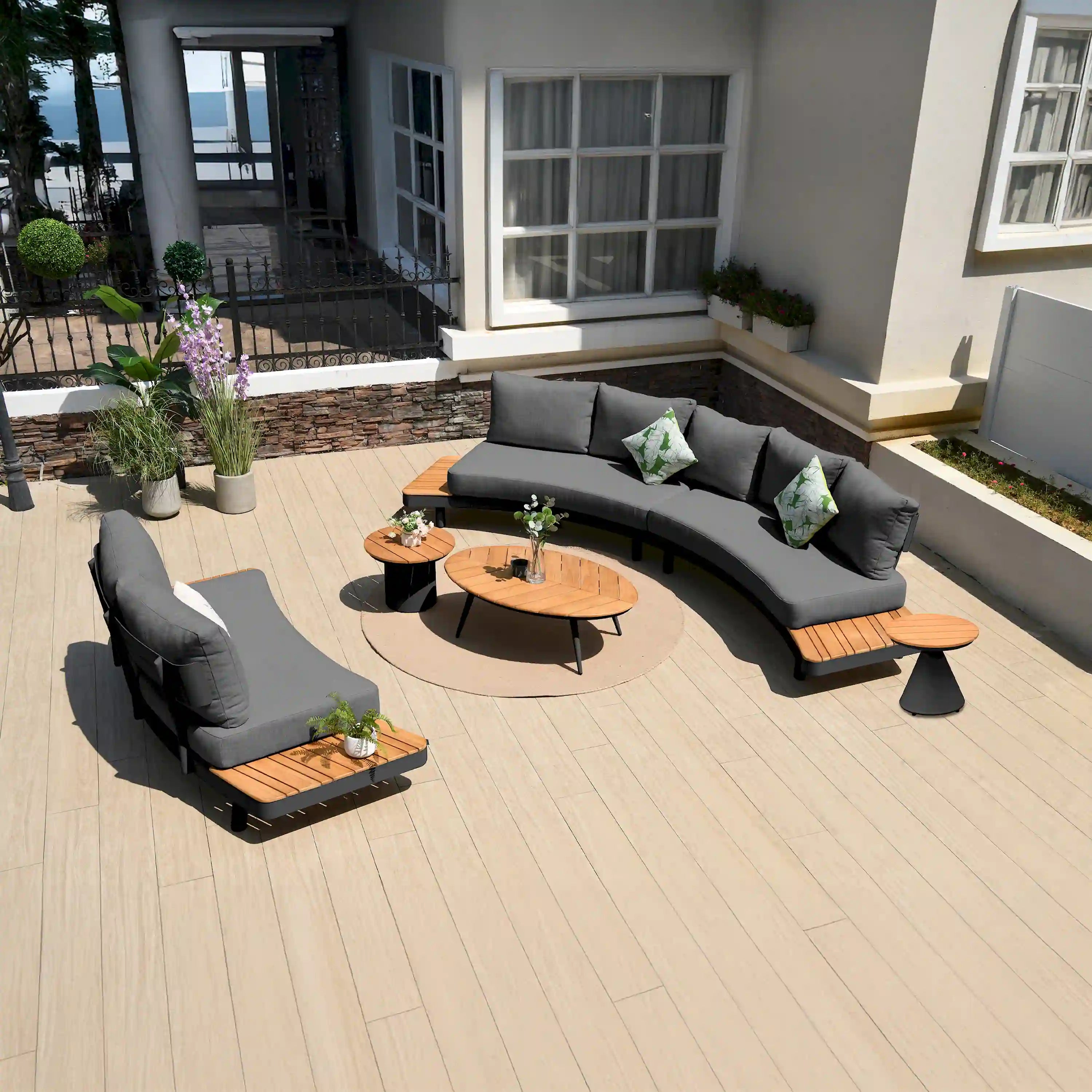 Outdoor 6-piece seating set: gray sectional sofa, teak slat chairs, round teak coffee table