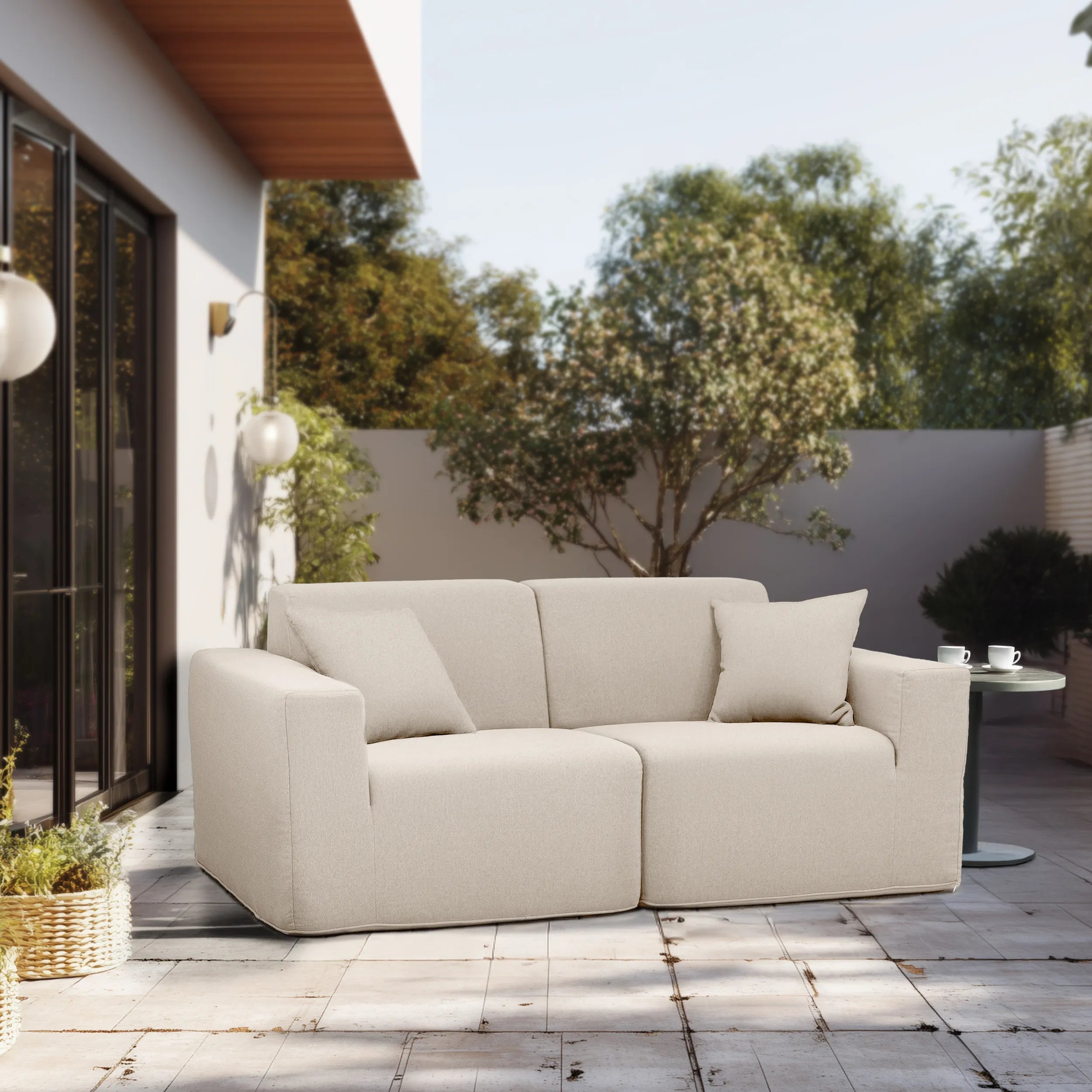 Beige outdoor sectional sofa set with three seat cushions and two back cushions