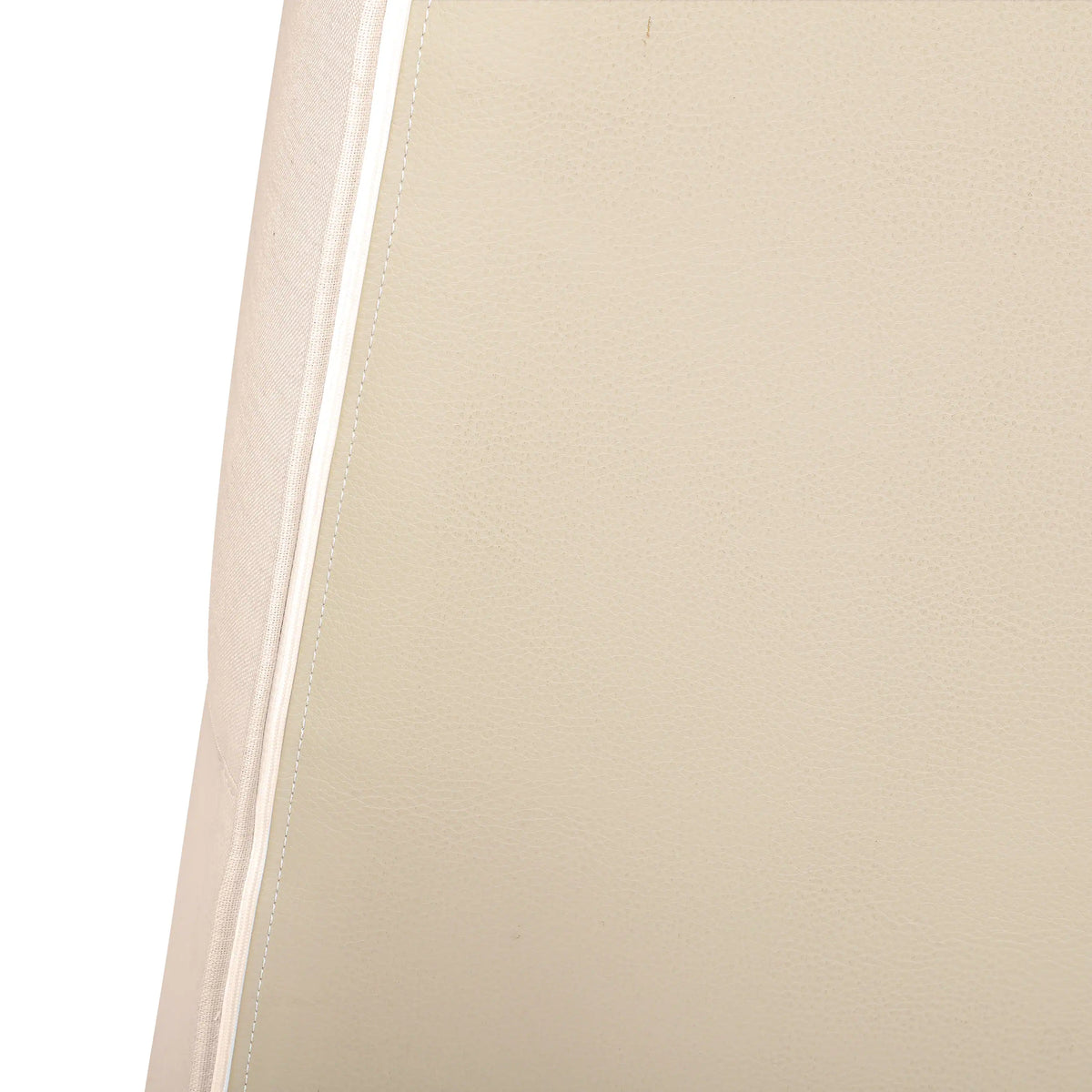Beige upholstered armrest with neat stitched seam detail