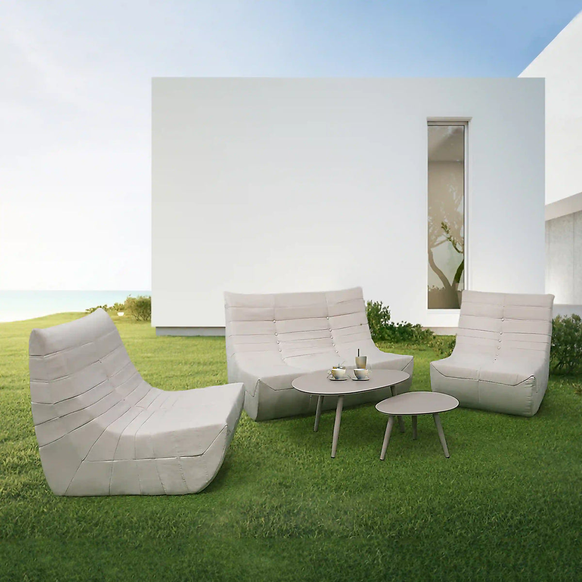 Beige outdoor seating set with three pieces: two chairs and a round table