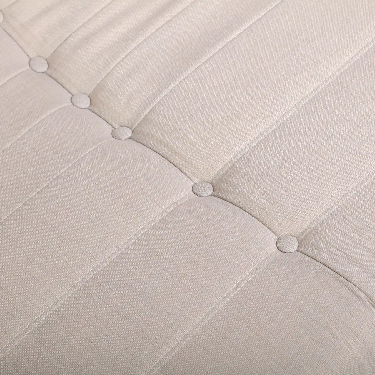 Beige outdoor foam loveseat cushion with tufted button details and seam lines
