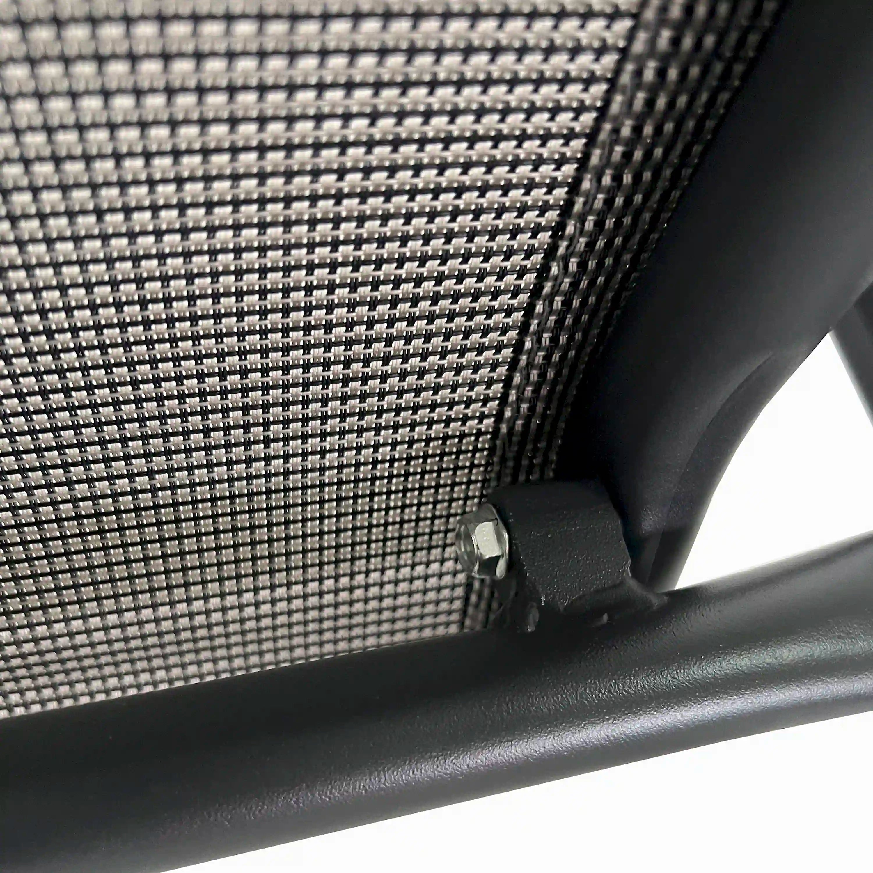 Chair arm and mesh corner detail with metal bracket and woven texture