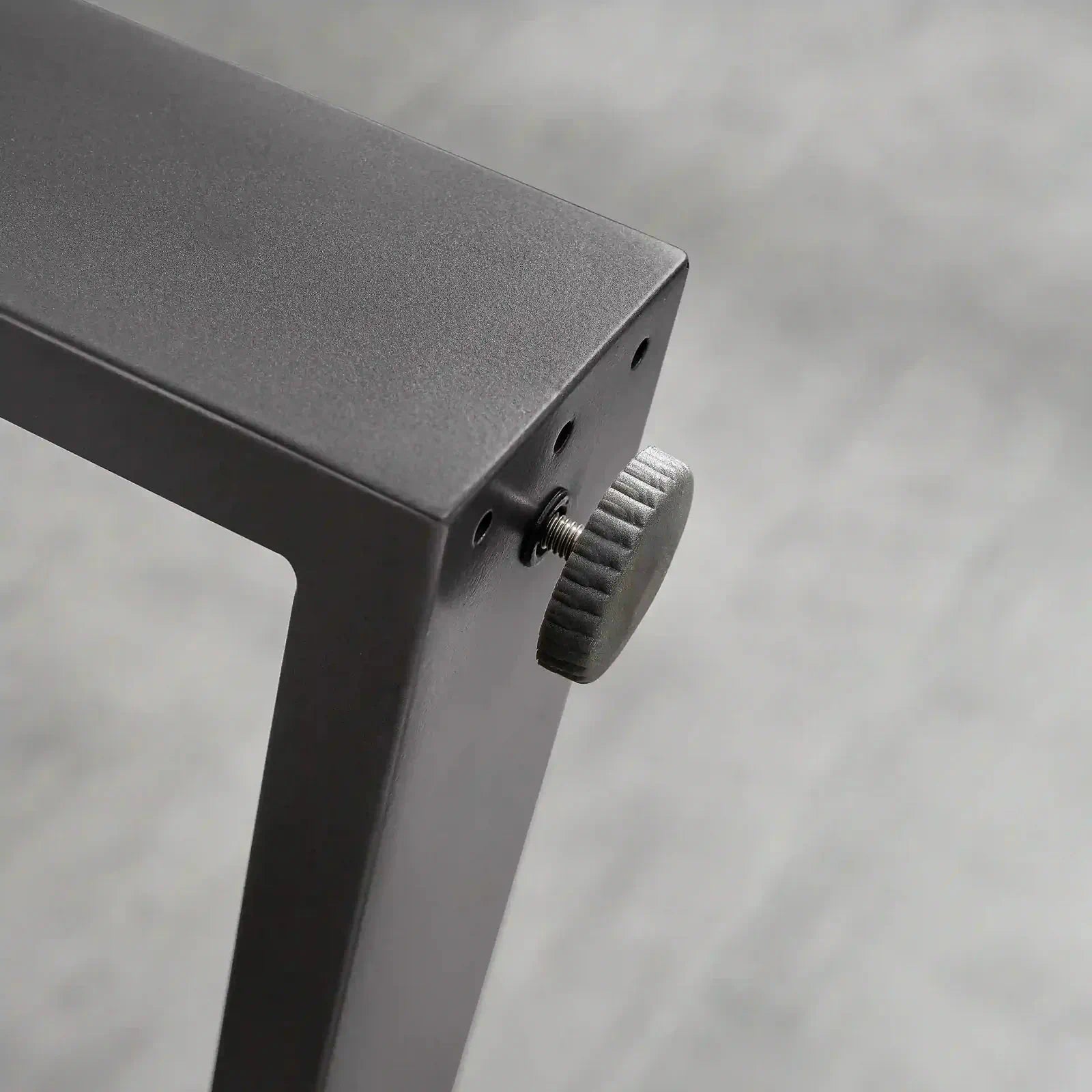 Black firepit table side panel with ribbed burner knob and control hardware