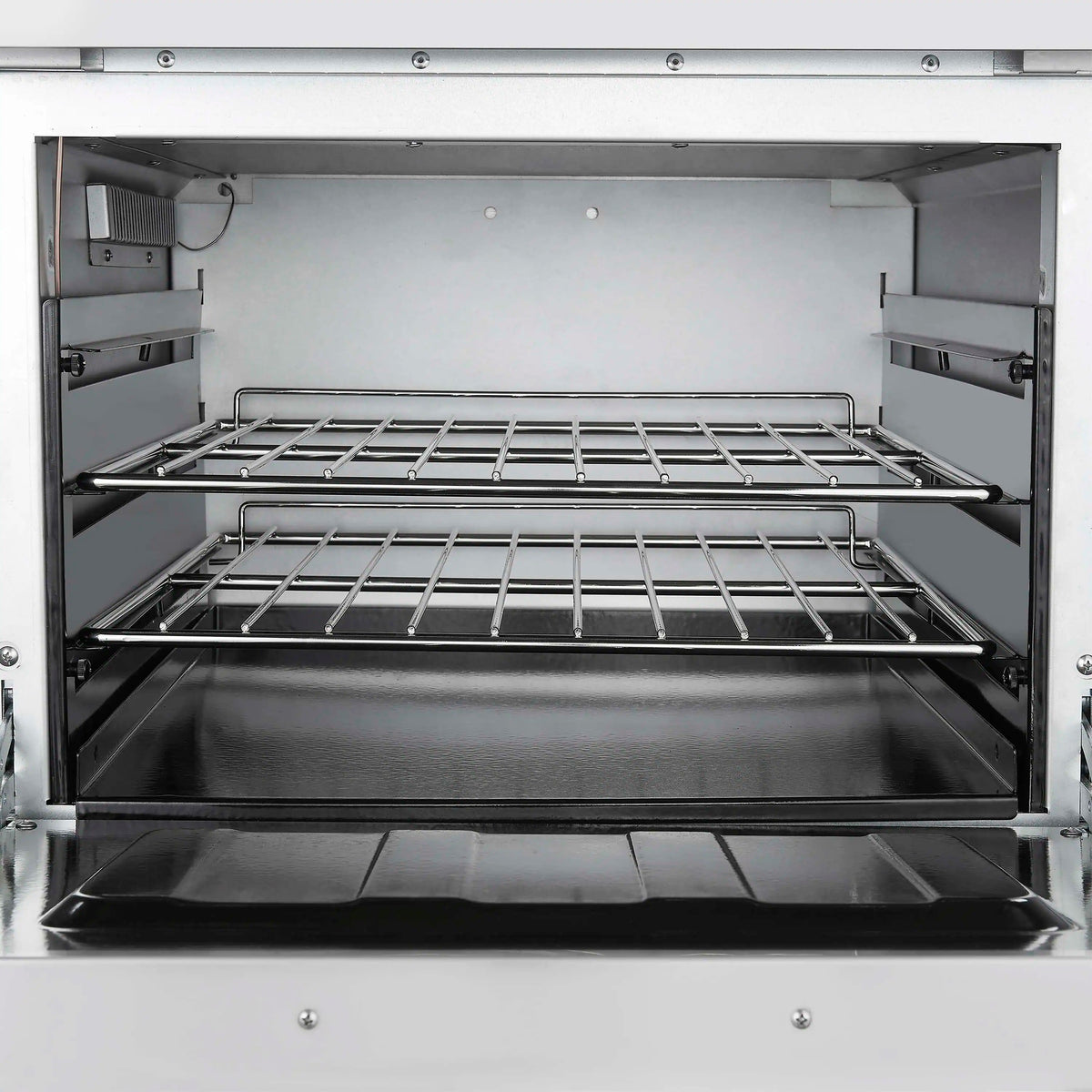 Open stainless oven with two wire racks inside the gas range