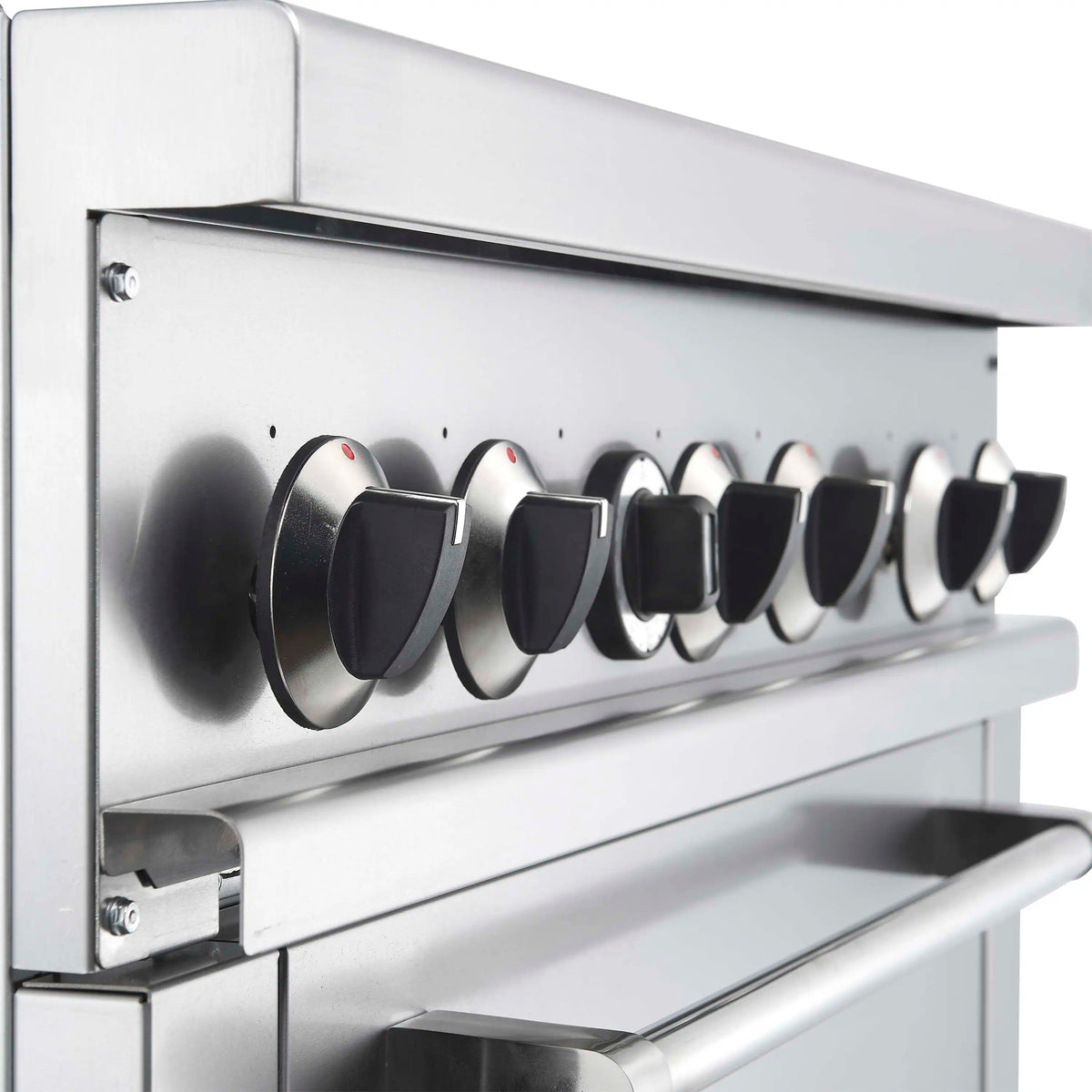 Stainless steel gas range control panel with six round burner knobs and red indicator dots