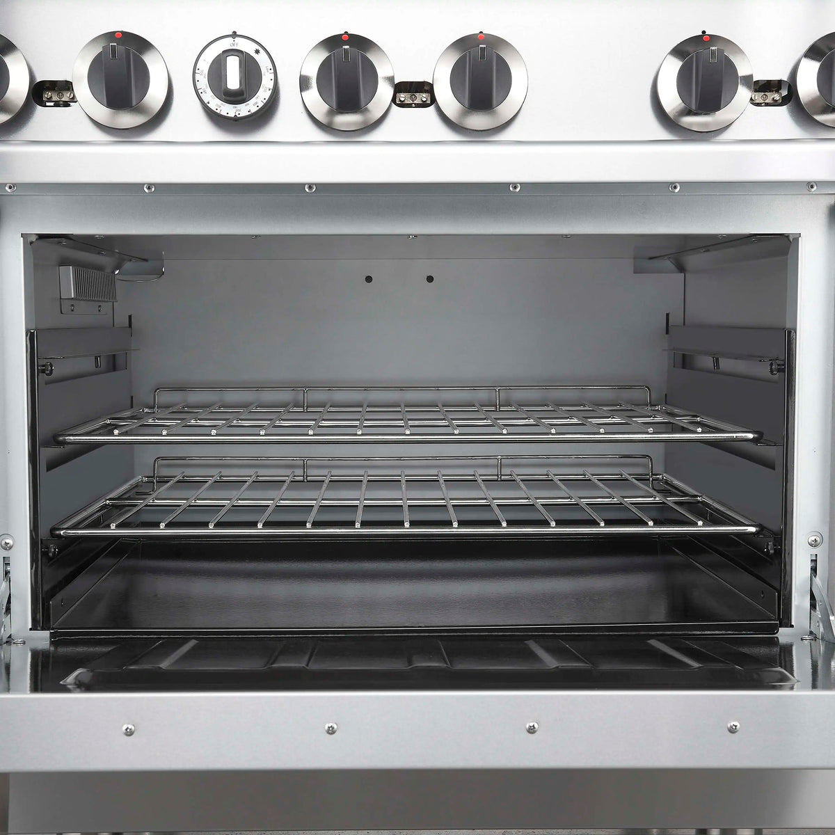 Open stainless steel oven cavity with top and bottom racks and side supports
