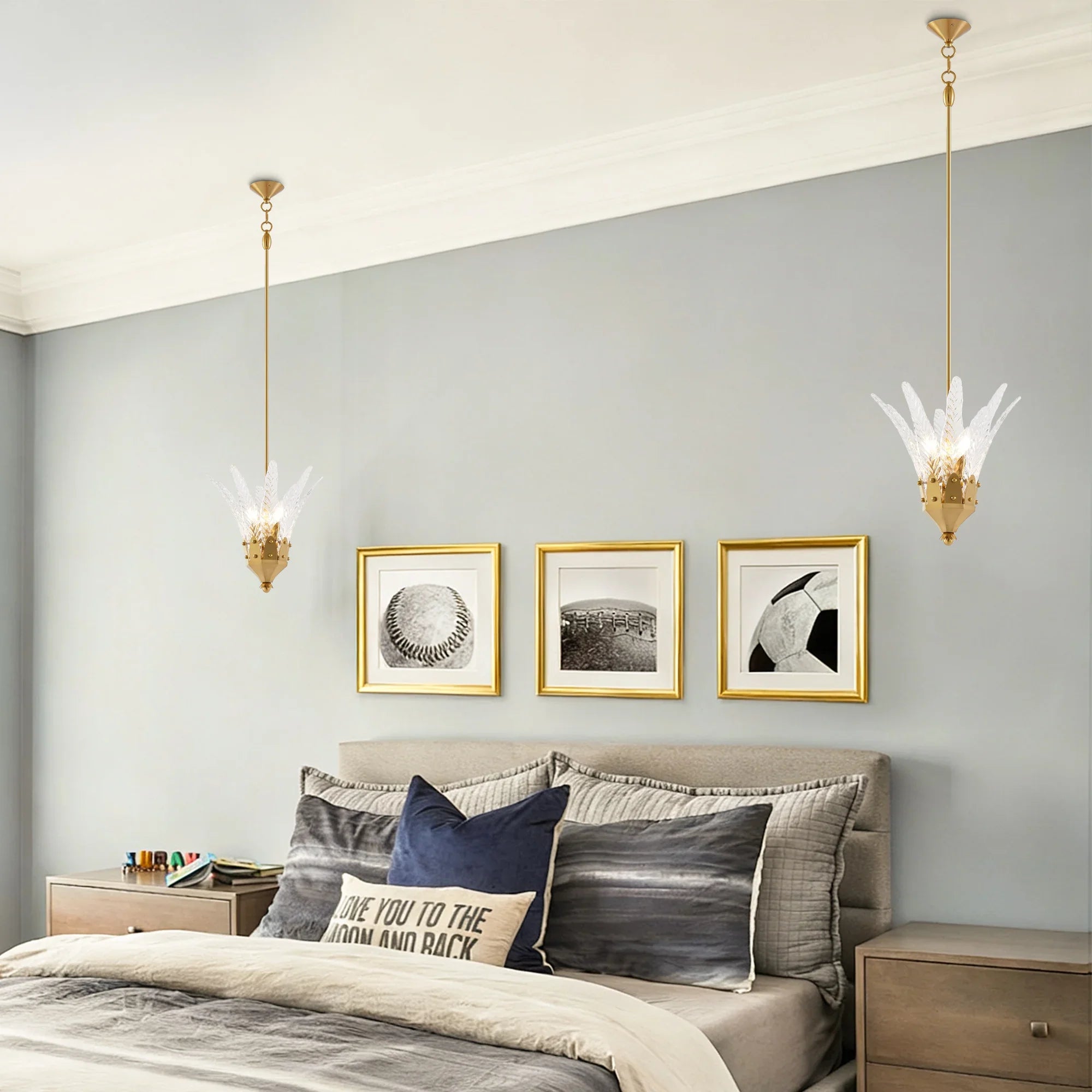 Feather-shaped island pendant light with white feather cluster and golden hanging chain