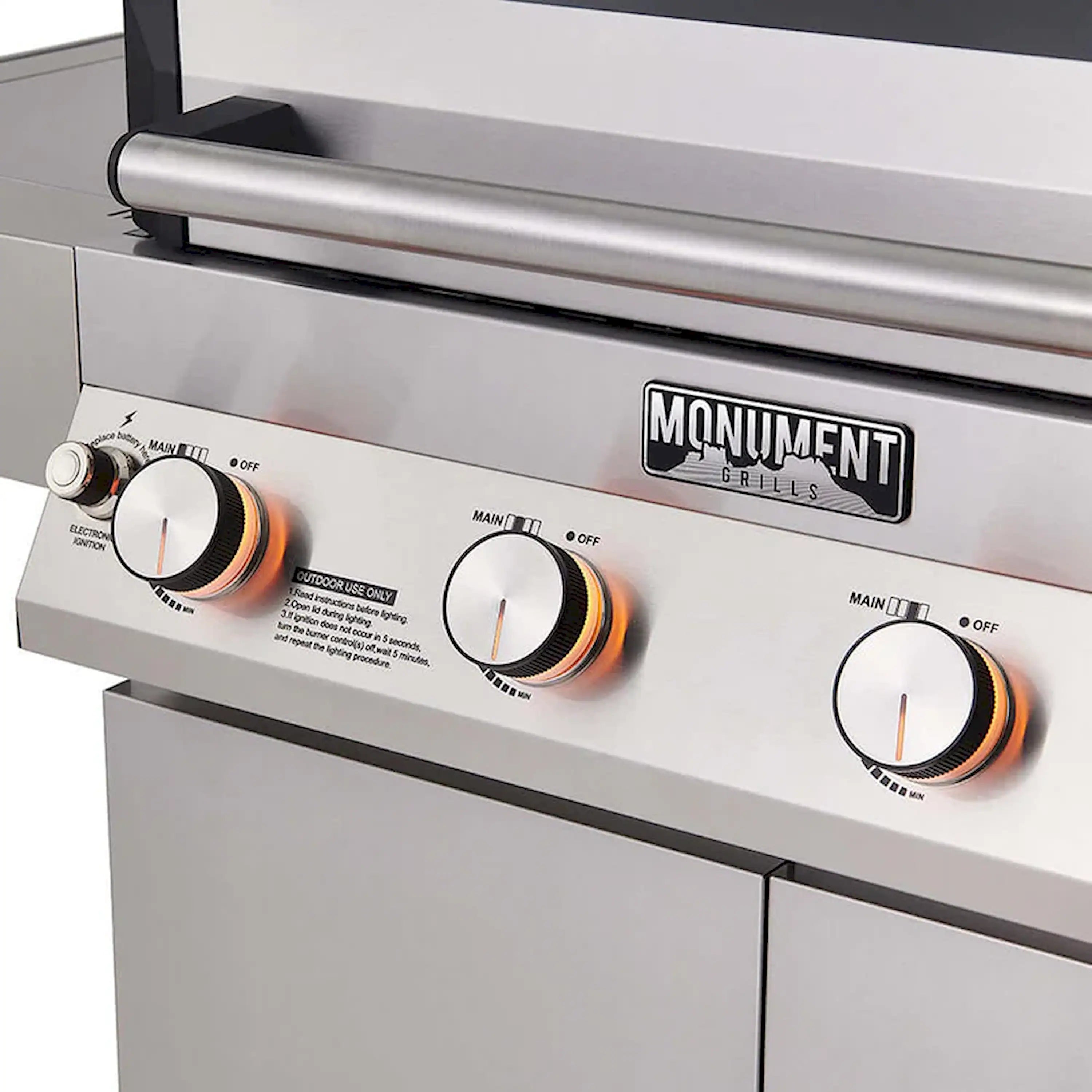Stainless steel propane grill front panel with burner knobs and control labels