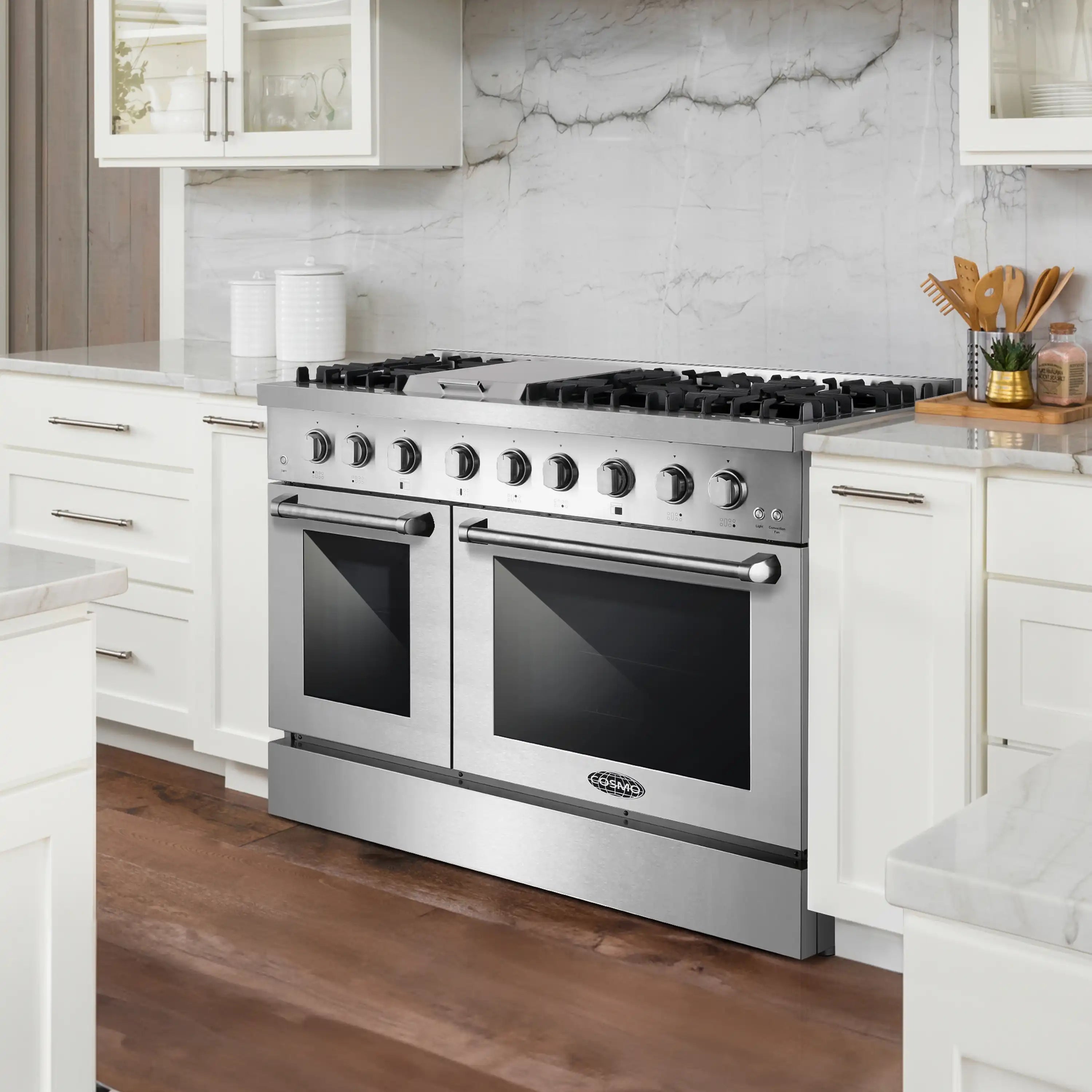 Stainless steel dual fuel range in kitchen setting with two ovens and front burners