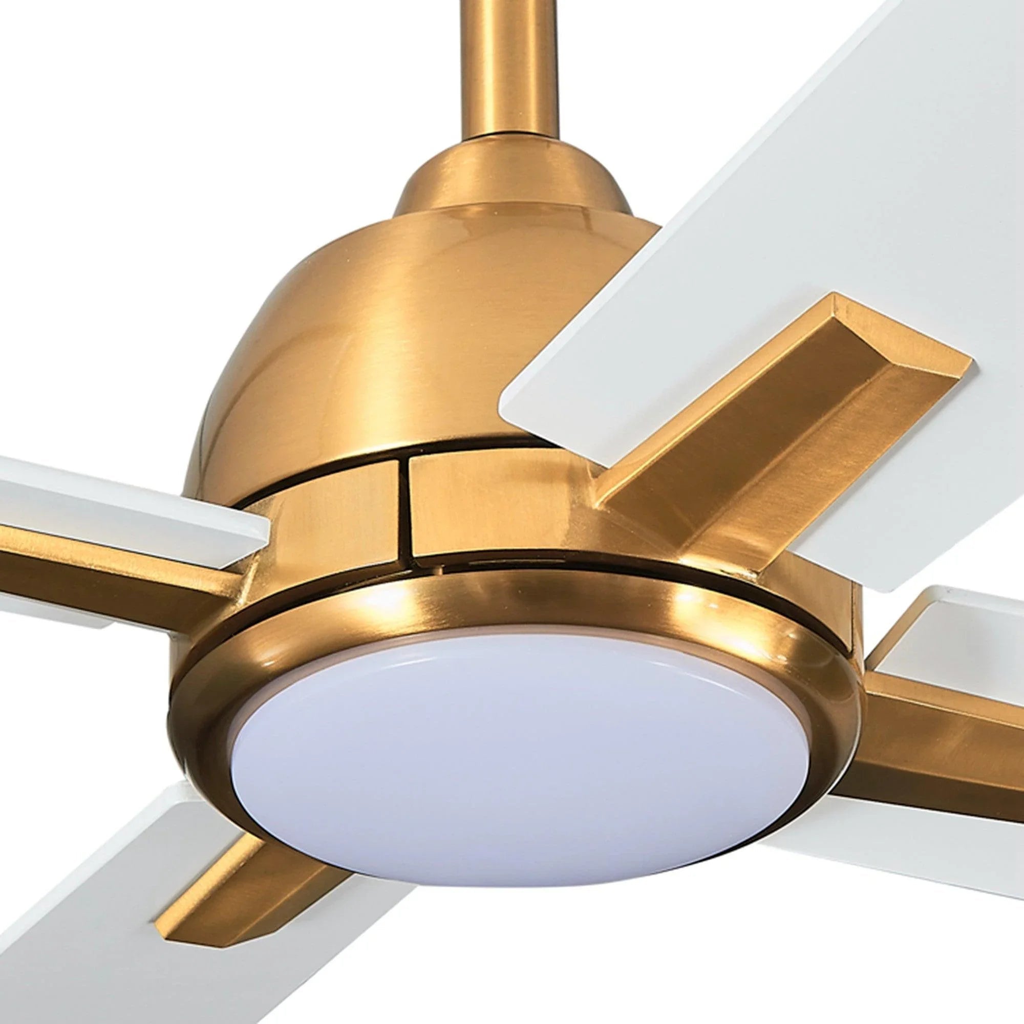 Close-up of golden ceiling fan motor housing with glowing white light and blades