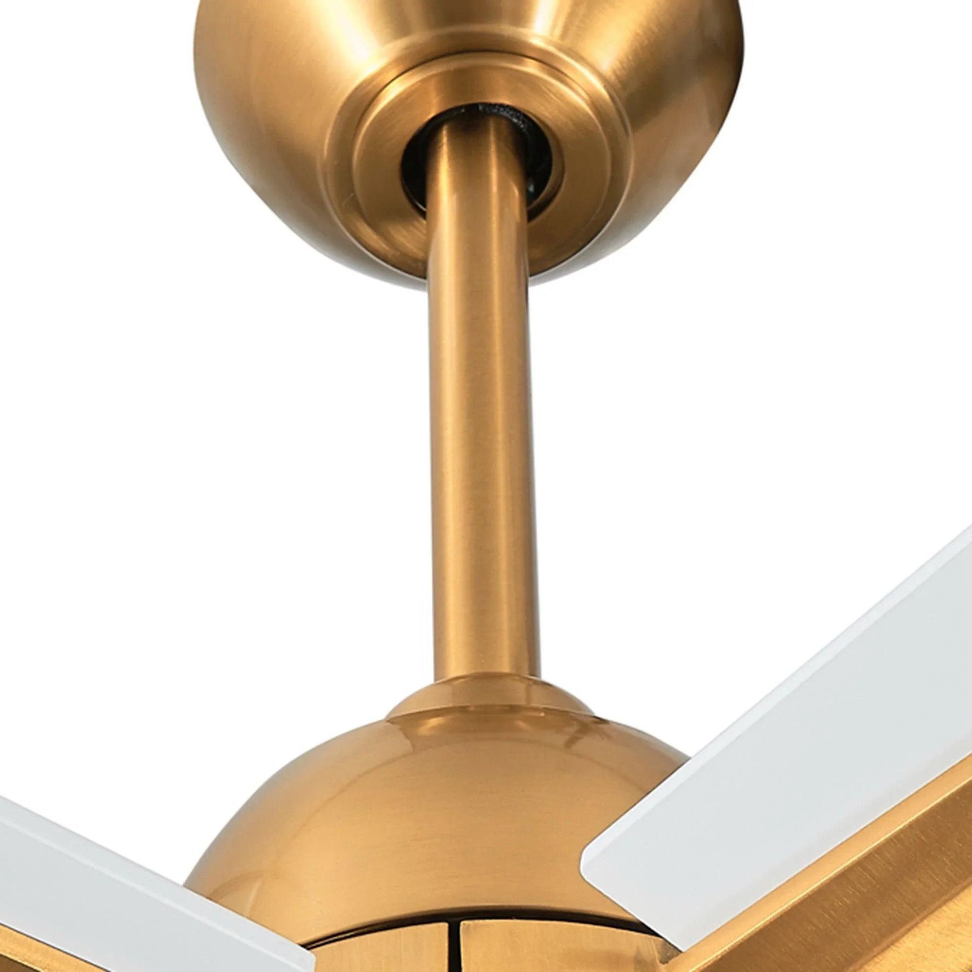 Close-up of golden downrod and motor housing on a ceiling fan