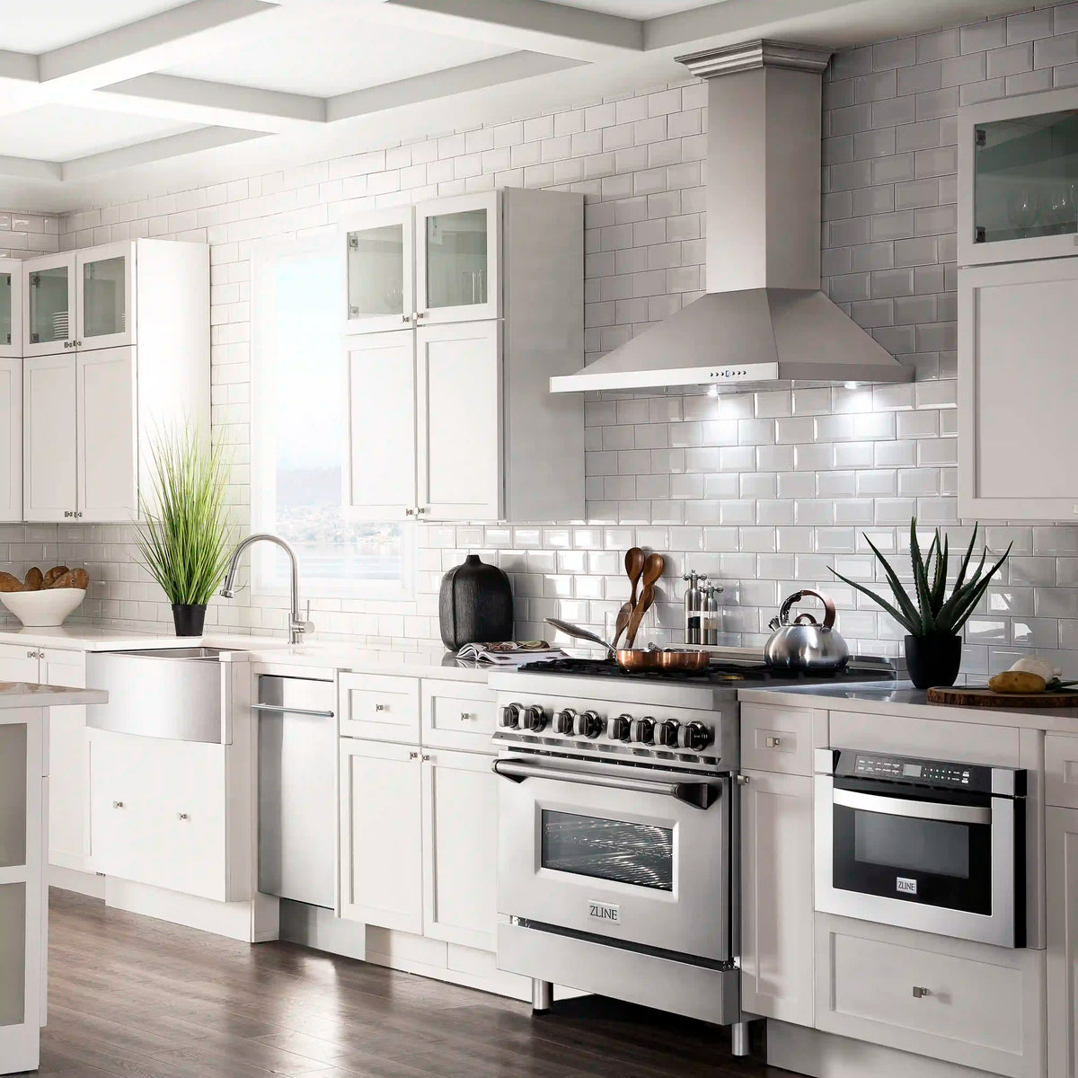 Stainless steel dual-fuel gas range with six brass burners and electric oven